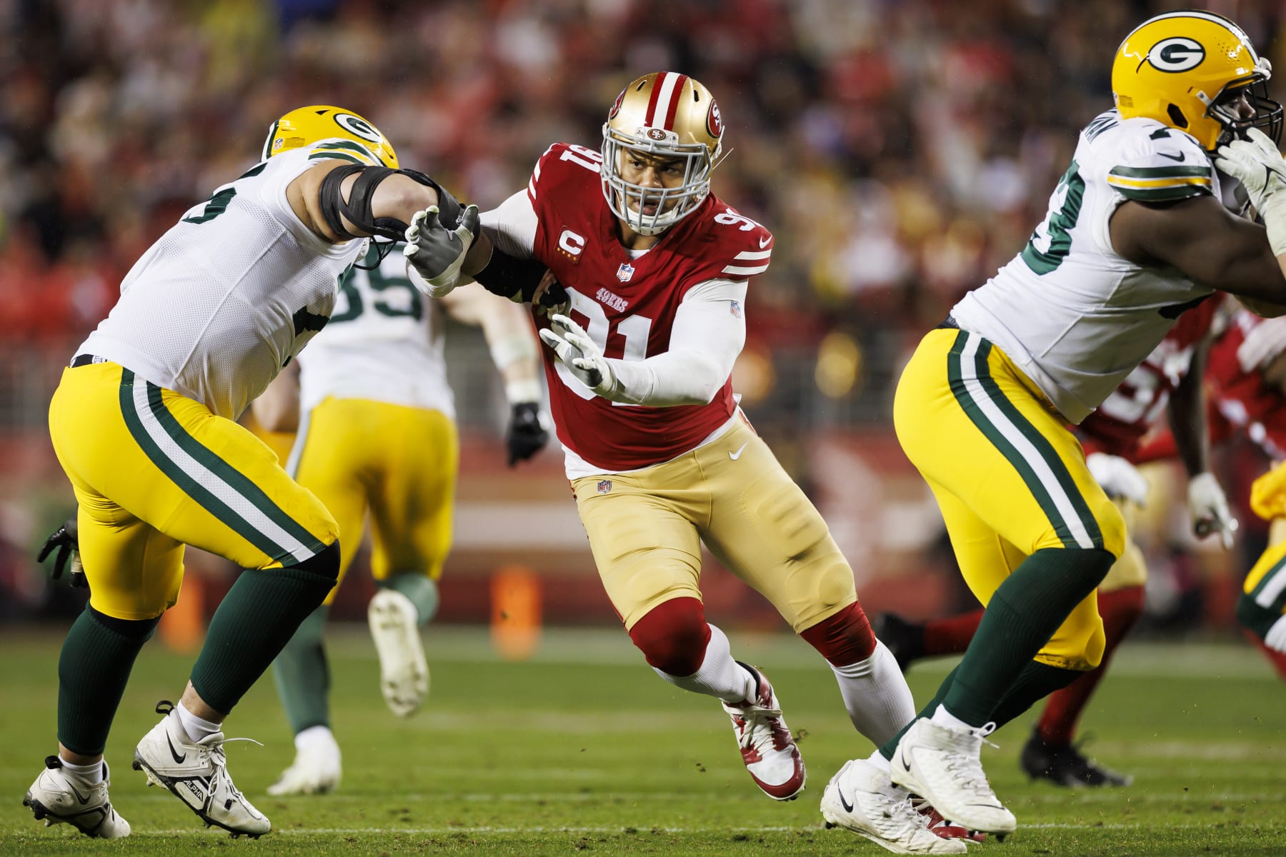 SANTA CLARA, CALIFORNIA - JANUARY 20: Arik Armstead #91 of the San Francisco 49ers rushes the line of scrimmage during an NFL divisional round playoff football game against the Green Bay Packers at Levi's Stadium on January 20, 2024 in Santa Clara, California. (Photo by Ryan Kang/Getty Images)