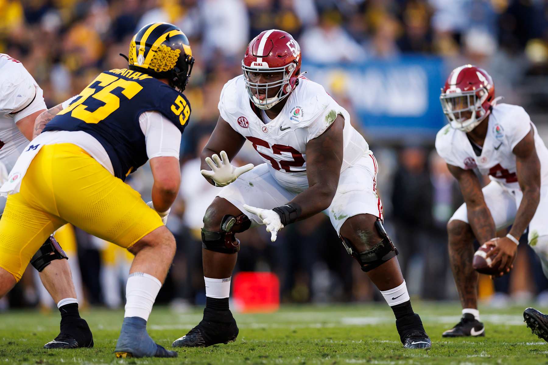 PASADENA, CALIFORNIA - JANUARY 01: Offensive lineman Tyler Booker #52 of the Alabama Crimson Tide blocks during the CFP Semifinal Rose Bowl Game against the Michigan Wolverines at Rose Bowl Stadium on January 1, 2024 in Pasadena, California. (Photo by Ryan Kang/Getty Images)