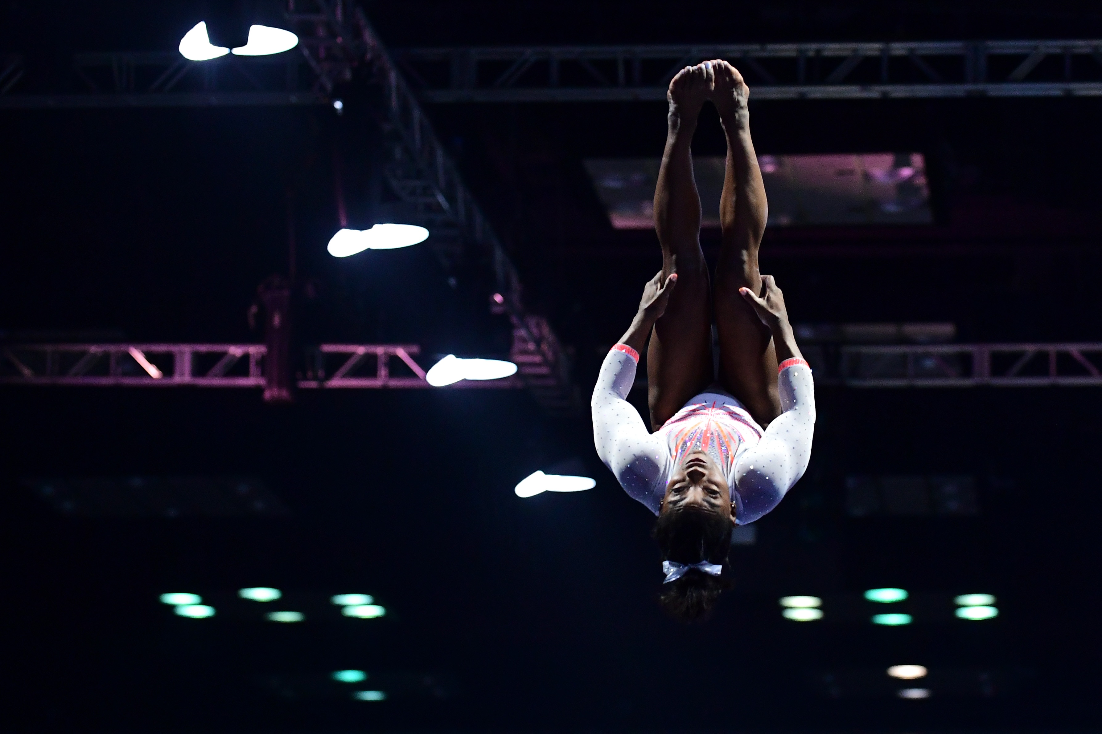 INDIANAPOLIS, INDIANA - MAY 22: Simone Biles lands the Yurchenko double pike while competing on the vault during the 2021 GK U.S. Classic gymnastics competition at the Indiana Convention Center on May 22, 2021 in Indianapolis, Indiana. Biles became the first woman in history to land the Yurchenko double pike in competition. (Photo by Emilee Chinn/Getty Images)