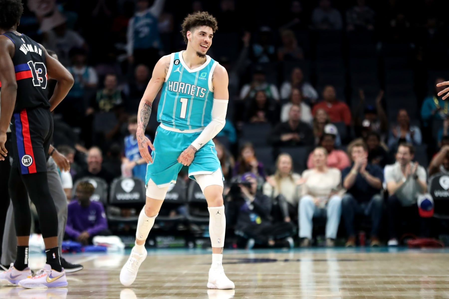 CHARLOTTE, NORTH CAROLINA - FEBRUARY 27: LaMelo Ball #1 of the Charlotte Hornets reacts after making a three pointer during the first half of their basketball game against the Detroit Pistons at Spectrum Center on February 27, 2023 in Charlotte, North Carolina. NOTE TO USER: User expressly acknowledges and agrees that, by downloading and or using this photograph, User is consenting to the terms and conditions of the Getty Images License Agreement. (Photo by David Jensen/Getty Images)