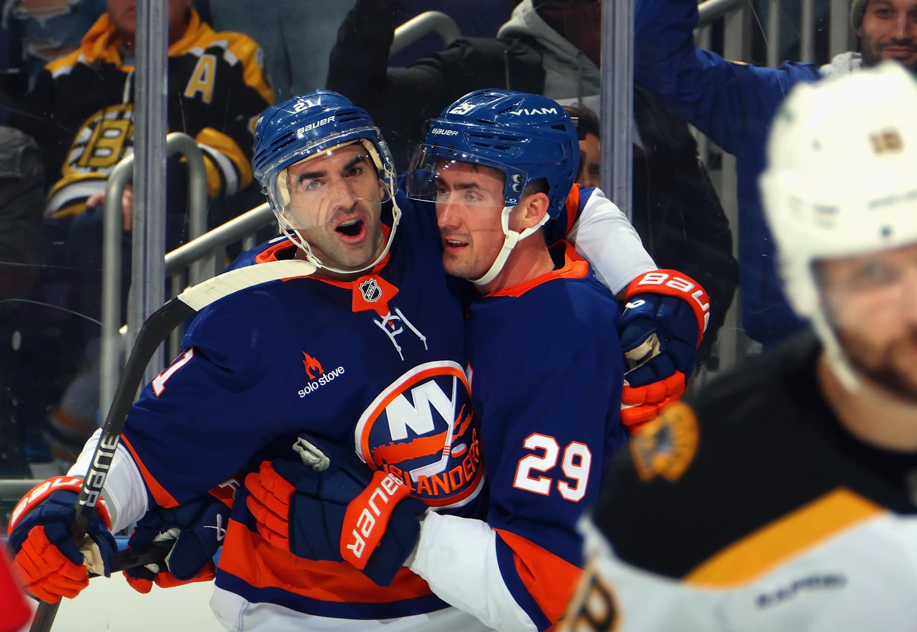 ELMONT, NEW YORK - NOVEMBER 27: Brock Nelson #29 of the New York Islanders (r) celebrates his second period goal against the Boston Bruins along with Kyle Palmieri #21 (l) at UBS Arena on November 27, 2024 in Elmont, New York. (Photo by Bruce Bennett/Getty Images)