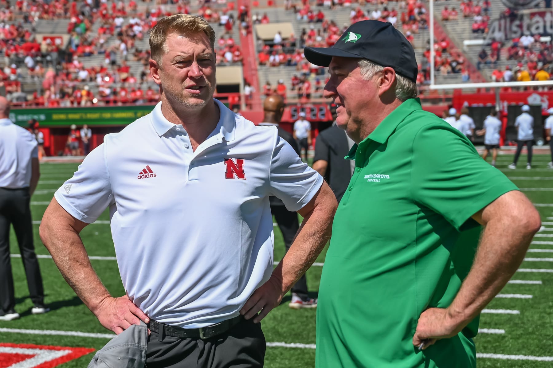 LINCOLN, NE - SEPTEMBER 3: Head coach Scott Frost of the Nebraska Cornhuskers and head coach Bubba Schweigert of the North Dakota Fighting Hawks meet on the field before the game at Memorial Stadium on September 3, 2022 in Lincoln, Nebraska. (Photo by Steven Branscombe/Getty Images)