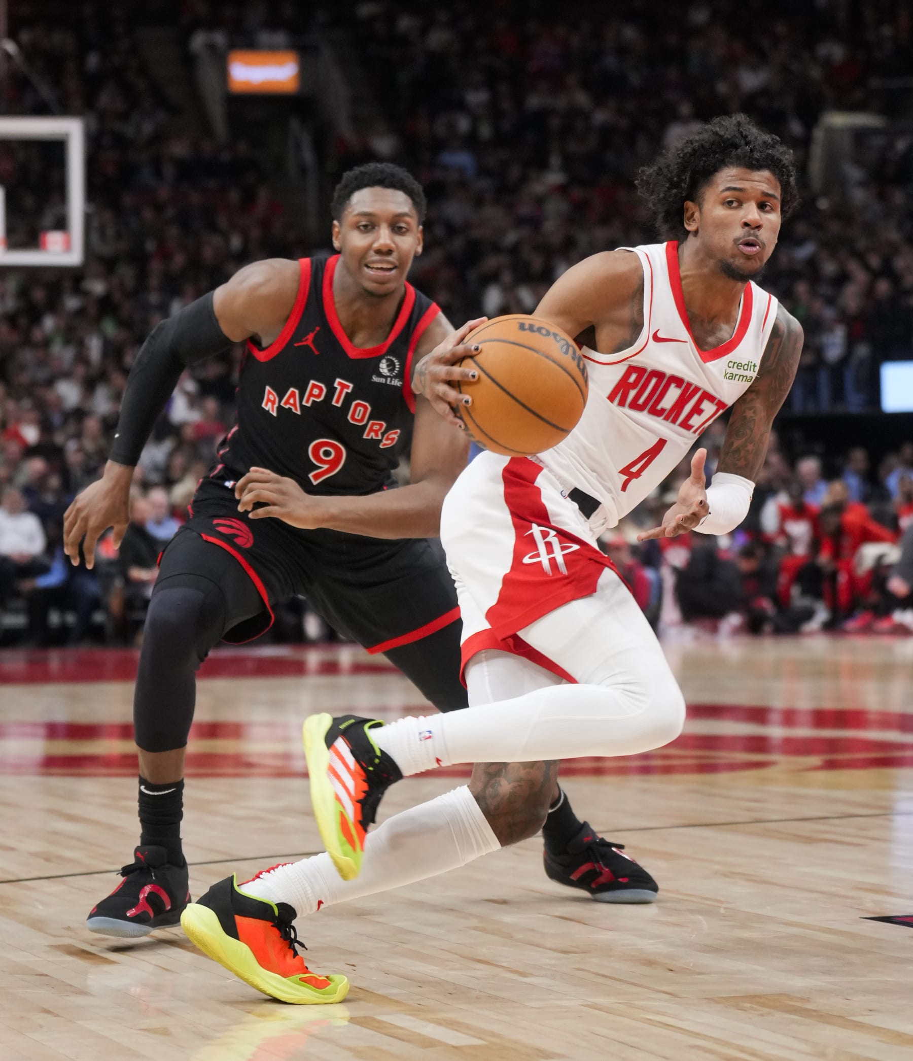 TORONTO, ON - FEBRUARY 9: Jalen Green #4 of the Houston Rockets dribbles against RJ Barrett #9 of the Toronto Raptors during the second half of their basketball game at the Scotiabank Arena on February 9, 2024 in Toronto, Ontario, Canada. NOTE TO USER: User expressly acknowledges and agrees that, by downloading and/or using this Photograph, user is consenting to the terms and conditions of the Getty Images License Agreement. (Photo by Mark Blinch/Getty Images)