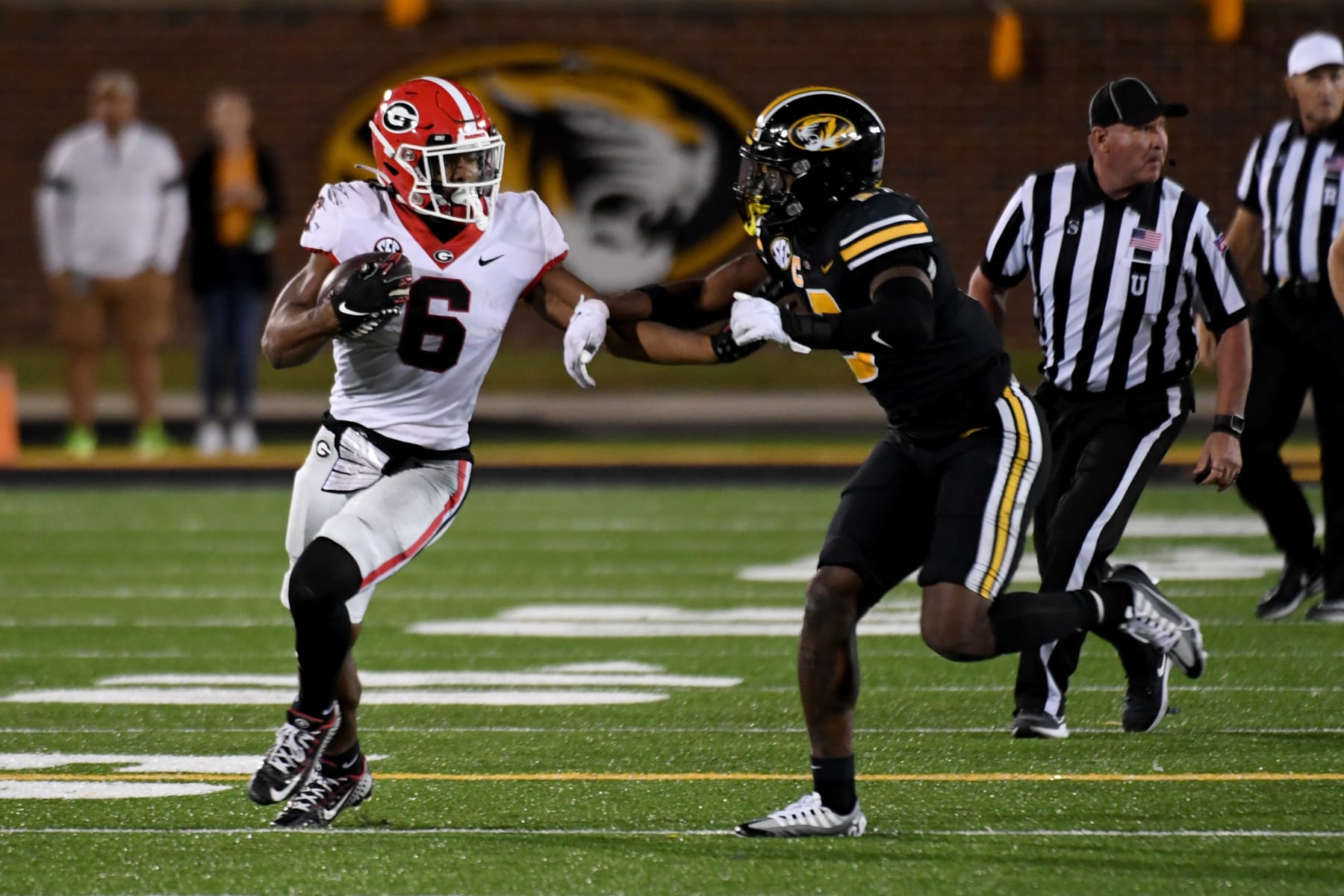 Georgia running back Kenny McIntosh (6) runs with the ball as Missouri defensive back Martez Manuel defends during the second half of an NCAA college football game Saturday, Oct. 1, 2022, in Columbia, Mo. (AP Photo/L.G. Patterson)
