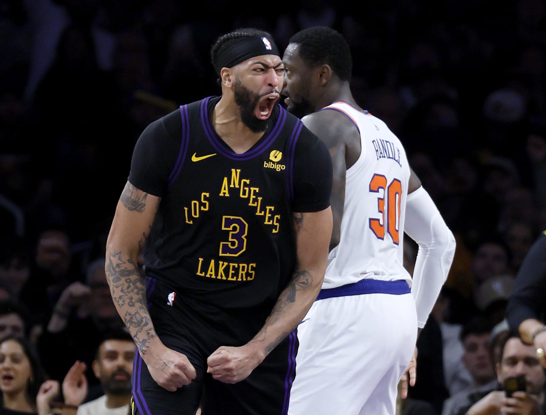 Los Angeles, CA - December 18: Lakers forward Anthony Davis, #3, left, celebrates his fourth period basket past Knicks forward Julius Randle, #30, right, at Crypto.com Arena in Los Angeles Monday, Dec. 18, 2023. (Allen J. Schaben / Los Angeles Times via Getty Images)