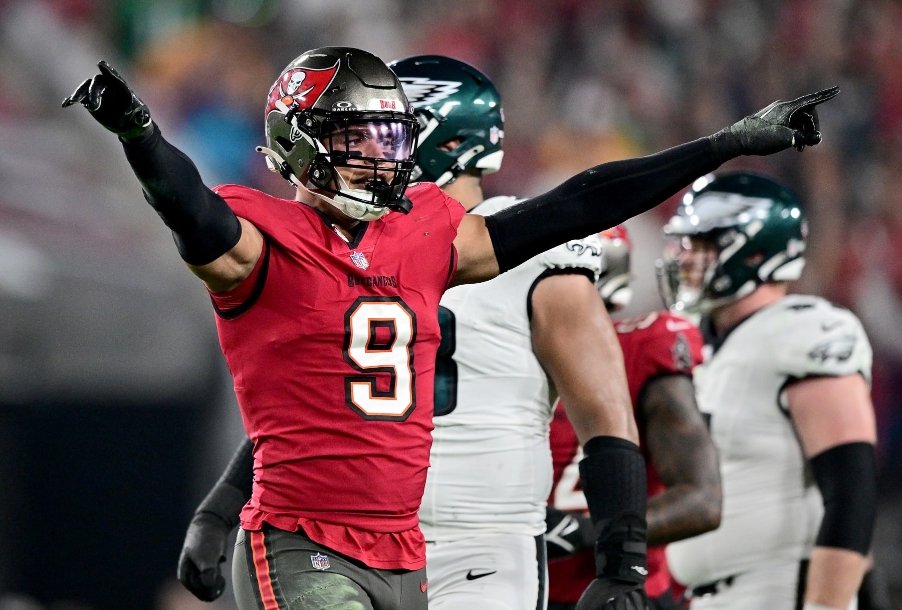 TAMPA, FLORIDA - JANUARY 15: Joe Tryon-Shoyinka #9 of the Tampa Bay Buccaneers celebrates a play against the Philadelphia Eagles during the second quarter in the NFC Wild Card Playoffs at Raymond James Stadium on January 15, 2024 in Tampa, Florida. (Photo by Julio Aguilar/Getty Images)