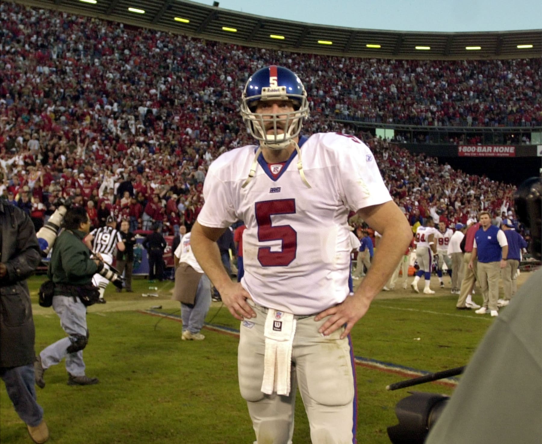 New York Giants quarterback Kerry Collins stands on the field after the Giants lost to the San Francisco 49ers in their NFC Wild Card game in San Francisco, Sunday Jan. 5, 2003. The 49ers won the game, 39-38.(AP Photo/Julie Jacobson)