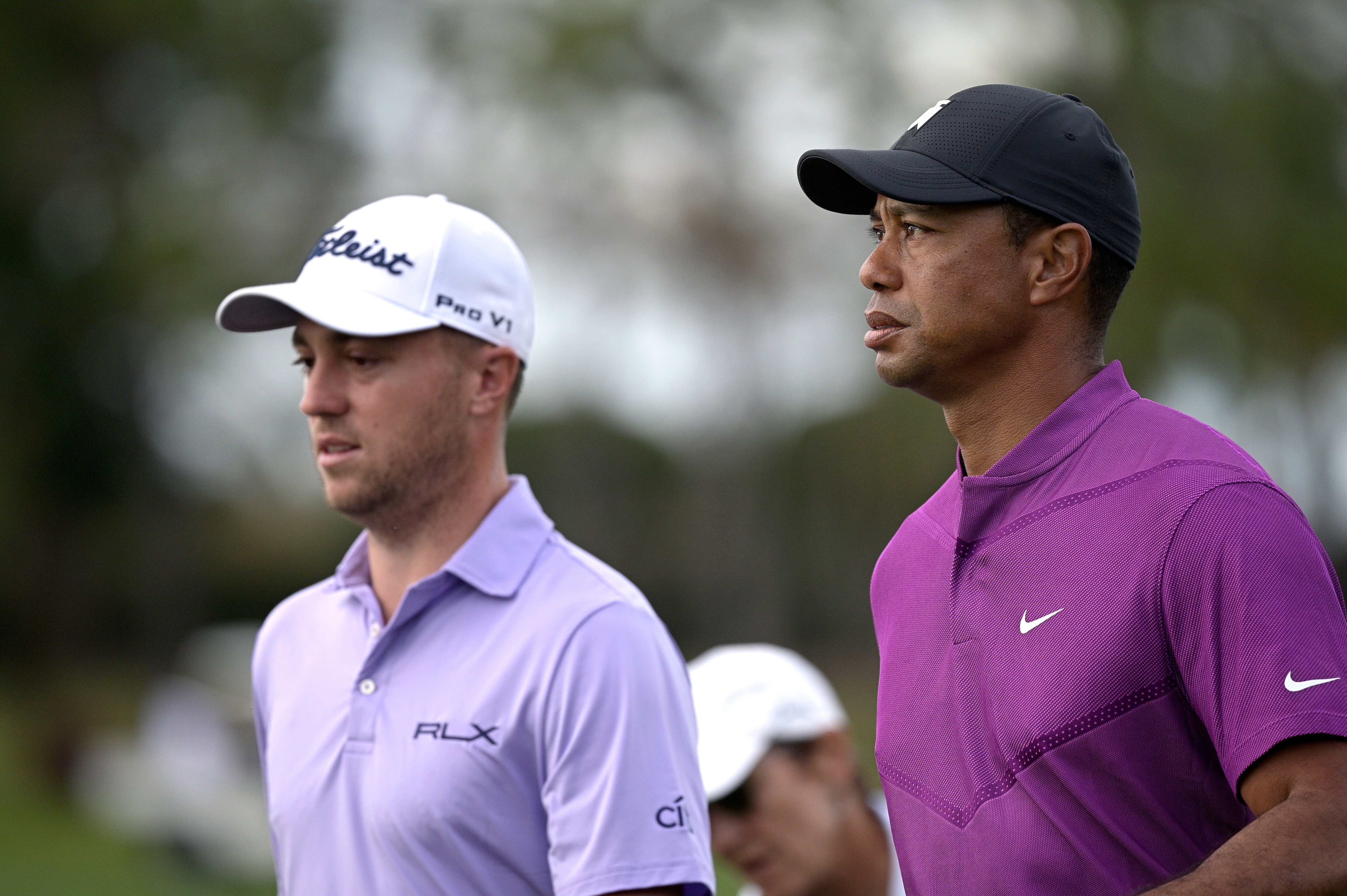 Tiger Woods, right, and Justin Thomas walk on the 16th fairway during the first round of the PNC Championship golf tournament, Saturday, Dec. 19, 2020, in Orlando, Fla. (AP Photo/Phelan M. Ebenhack)