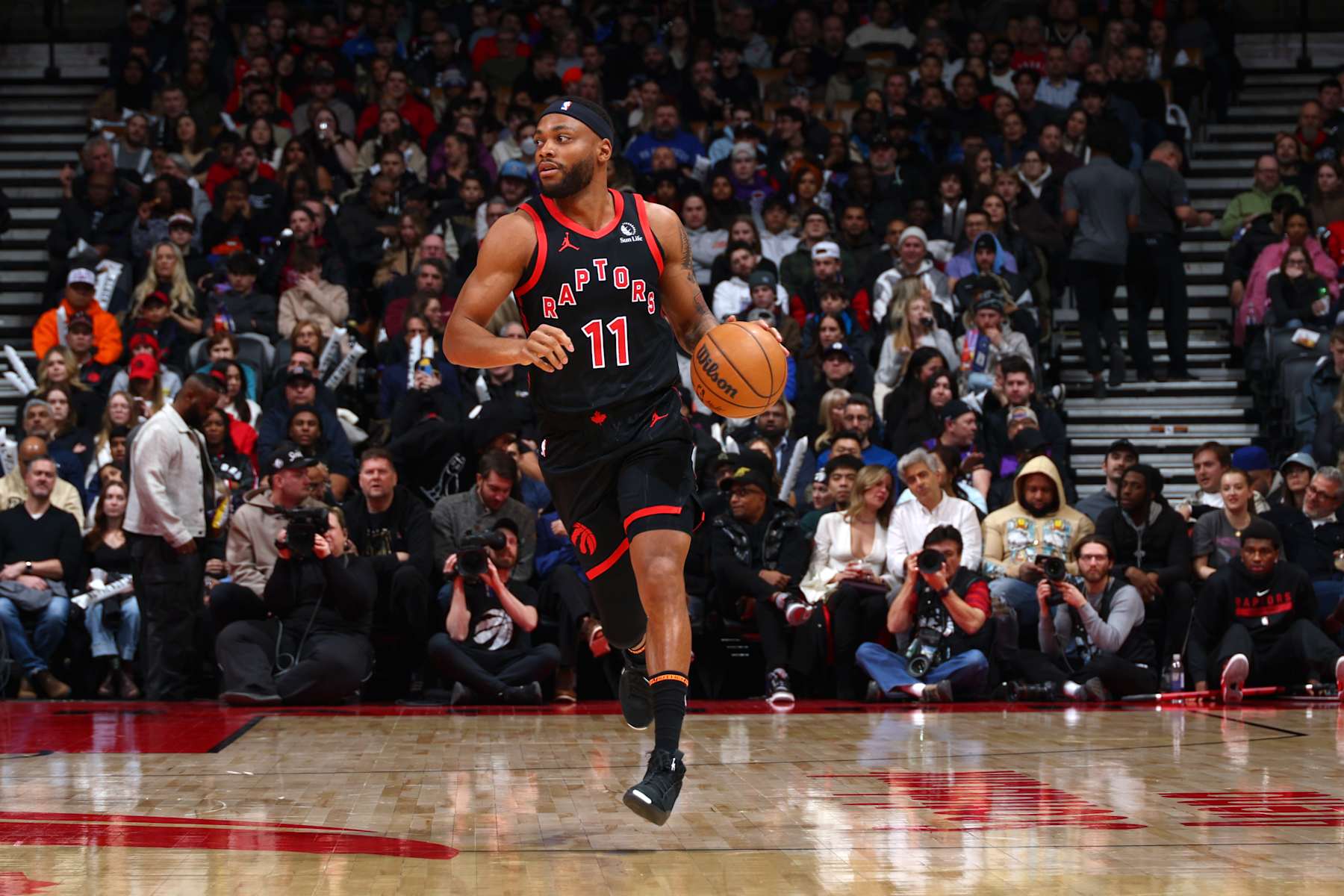 TORONTO, CANADA - JANUARY 3: Bruce Brown #11 of the Toronto Raptors dribbles the ball during the game against the Orlando Magic on January 3, 2025 at the Scotiabank Arena in Toronto, Ontario, Canada.  NOTE TO USER: User expressly acknowledges and agrees that, by downloading and or using this Photograph, user is consenting to the terms and conditions of the Getty Images License Agreement.  Mandatory Copyright Notice: Copyright 2025 NBAE (Photo by Vaughn Ridley/NBAE via Getty Images)