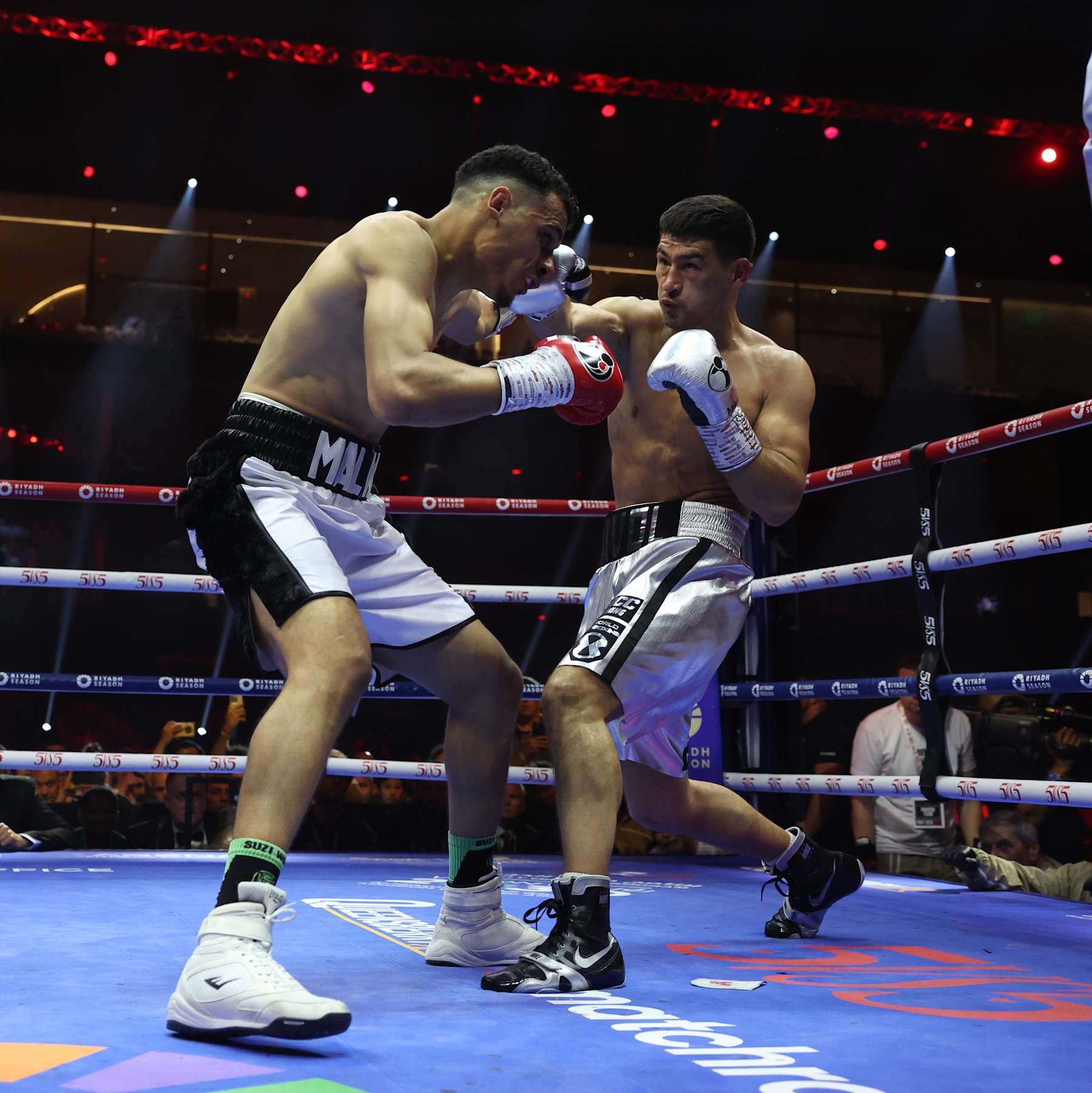 RIYADH, SAUDI ARABIA - JUNE 1: Dmitry Bivol (silver shorts) and Malik Zinad (white and black shorts) exchange punches during their WBA and IBO Light Heavyweight World Title contest on June 1, 2024 in Riyadh, Saudi Arabia. (Photo by Mark Robinson/Matchroom Boxing/Getty Images)