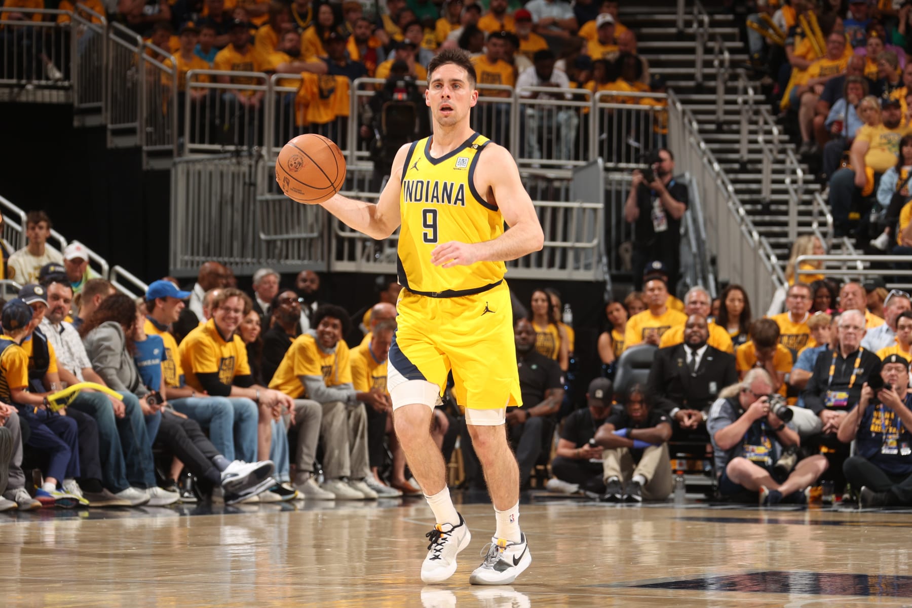 INDIANAPOLIS, IN - MAY 27: T.J. McConnell #9 of the Indiana Pacers dribbles the ball during the game against the Boston Celtics during Game 4 of the Eastern Conference Finals of the 2024 NBA Playoffs on May 27, 2024 at Gainbridge Fieldhouse in Indianapolis, Indiana. NOTE TO USER: User expressly acknowledges and agrees that, by downloading and or using this Photograph, user is consenting to the terms and conditions of the Getty Images License Agreement. Mandatory Copyright Notice: Copyright 2024 NBAE (Photo by Nathaniel S. Butler/NBAE via Getty Images)