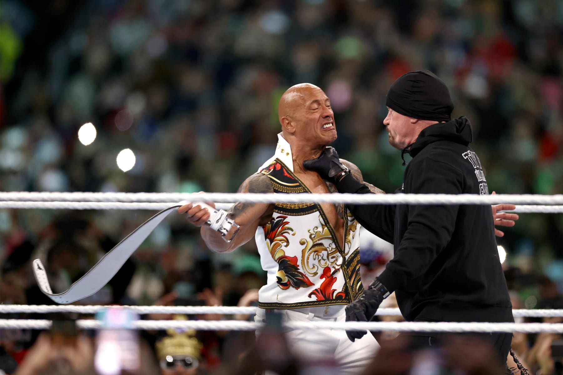 PHILADELPHIA, PENNSYLVANIA - APRIL 07: Dwayne "The Rock" Johnson fights against The Undertaker during Night Two at Lincoln Financial Field on April 07, 2024 in Philadelphia, Pennsylvania.  (Photo by Tim Nwachukwu/Getty Images)