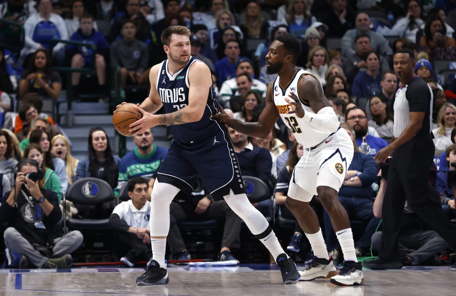DALLAS, TX - NOVEMBER 20: Luka Doncic #77 of the Dallas Mavericks handles the ball against the Denver Nuggets in the first half at American Airlines Center on November 20, 2022 in Dallas, Texas. NOTE TO USER: User expressly acknowledges and agrees that, by downloading and or using this photograph, User is consenting to the terms and conditions of the Getty Images License Agreement. (Photo by Ron Jenkins/Getty Images)