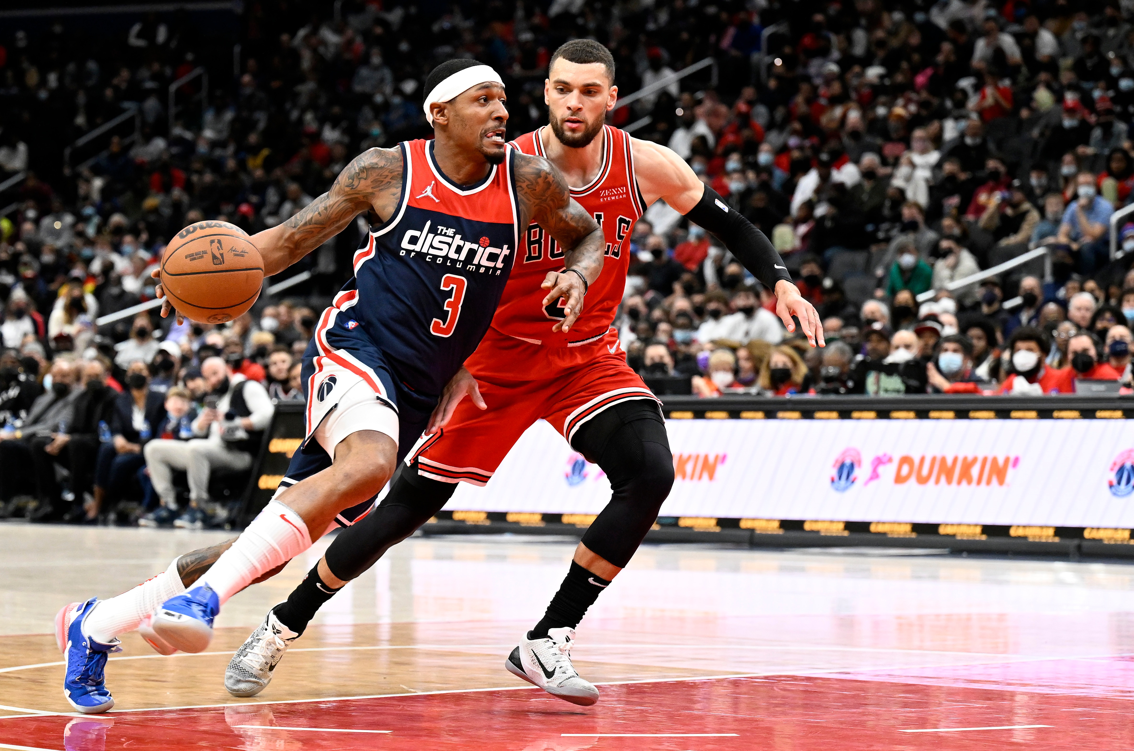 WASHINGTON, DC - JANUARY 01: Bradley Beal #3 of the Washington Wizards handles the ball against Zach LaVine #8 of the Chicago Bulls at Capital One Arena on January 01, 2022 in Washington, DC.  NOTE TO USER: User expressly acknowledges and agrees that, by downloading and or using this photograph, User is consenting to the terms and conditions of the Getty Images License Agreement. (Photo by G Fiume/Getty Images)