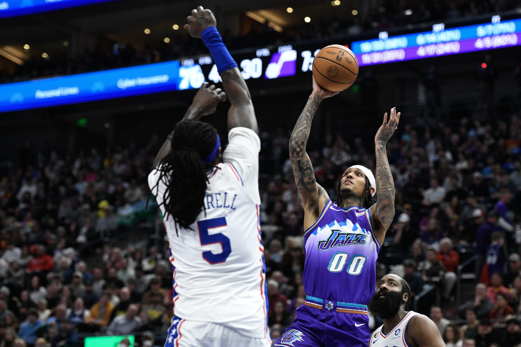 SALT LAKE CITY, UTAH - JANUARY 14: Jordan Clarkson #00 of the Utah Jazz shoots over Montrezl Harrell #5 of the Philadelphia 76ers during the first half of a game at Vivint Arena on January 14, 2023 in Salt Lake City, Utah. NOTE TO USER: User expressly acknowledges and agrees that, by downloading and or using this photograph, User is consenting to the terms and conditions of the Getty Images License Agreement. (Photo by Alex Goodlett/Getty Images)