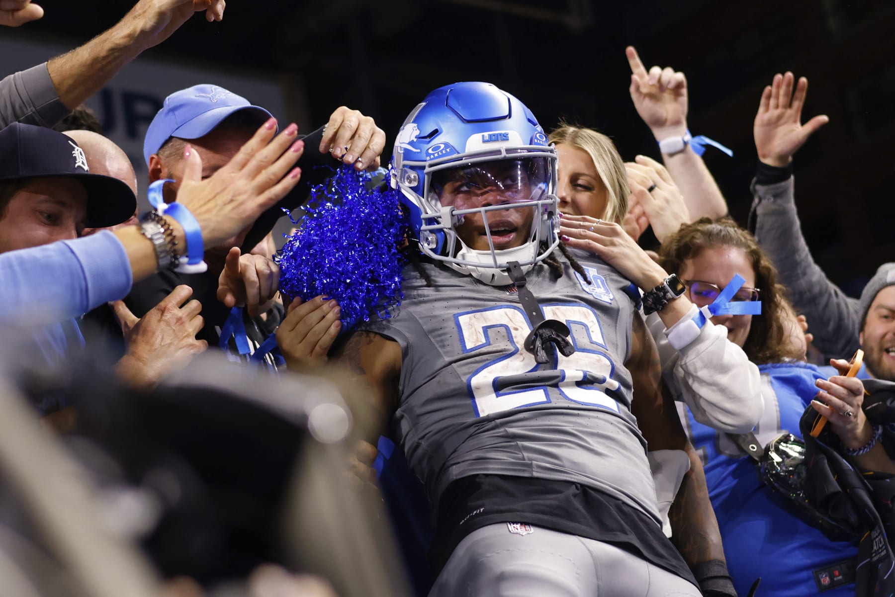 Detroit Lions running back Jahmyr Gibbs (26) celebrates with fans after scoring a touchdown against the Las Vegas Raider in the second half of an NFL football game at Ford Field in Detroit, Monday, Oct. 30, 2023. (AP Photo/Rick Osentoski)