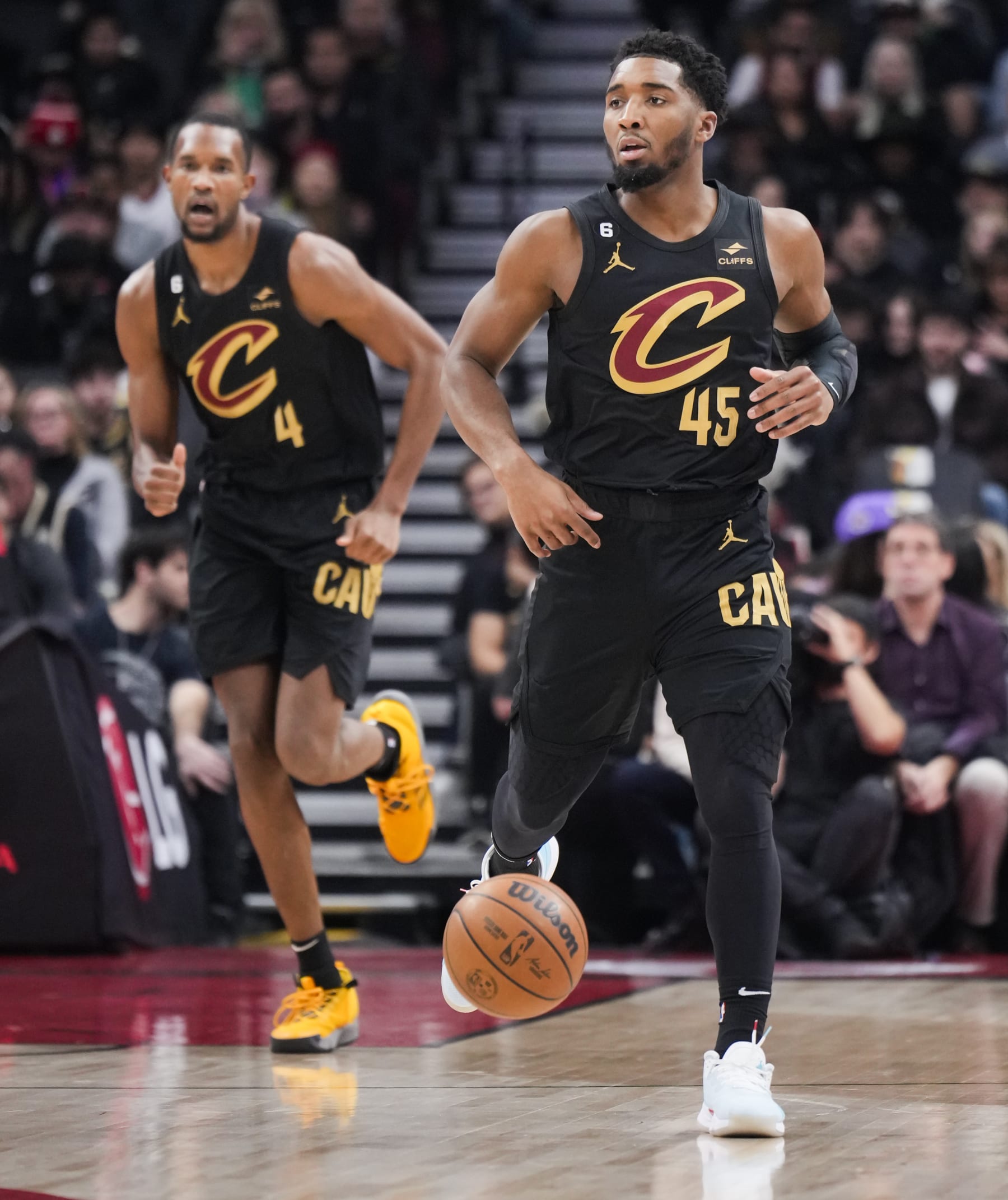 TORONTO, ON - NOVEMBER 28: Donovan Mitchell #45 of the Cleveland Cavaliers dribbles the ball up the floor ahead of teammate Evan Mobley #4 against the Toronto Raptors during the first half of their basketball game at the Scotiabank Arena on November 28, 2022 in Toronto, Ontario, Canada. NOTE TO USER: User expressly acknowledges and agrees that, by downloading and/or using this Photograph, user is consenting to the terms and conditions of the Getty Images License Agreement. (Photo by Mark Blinch/Getty Images)
