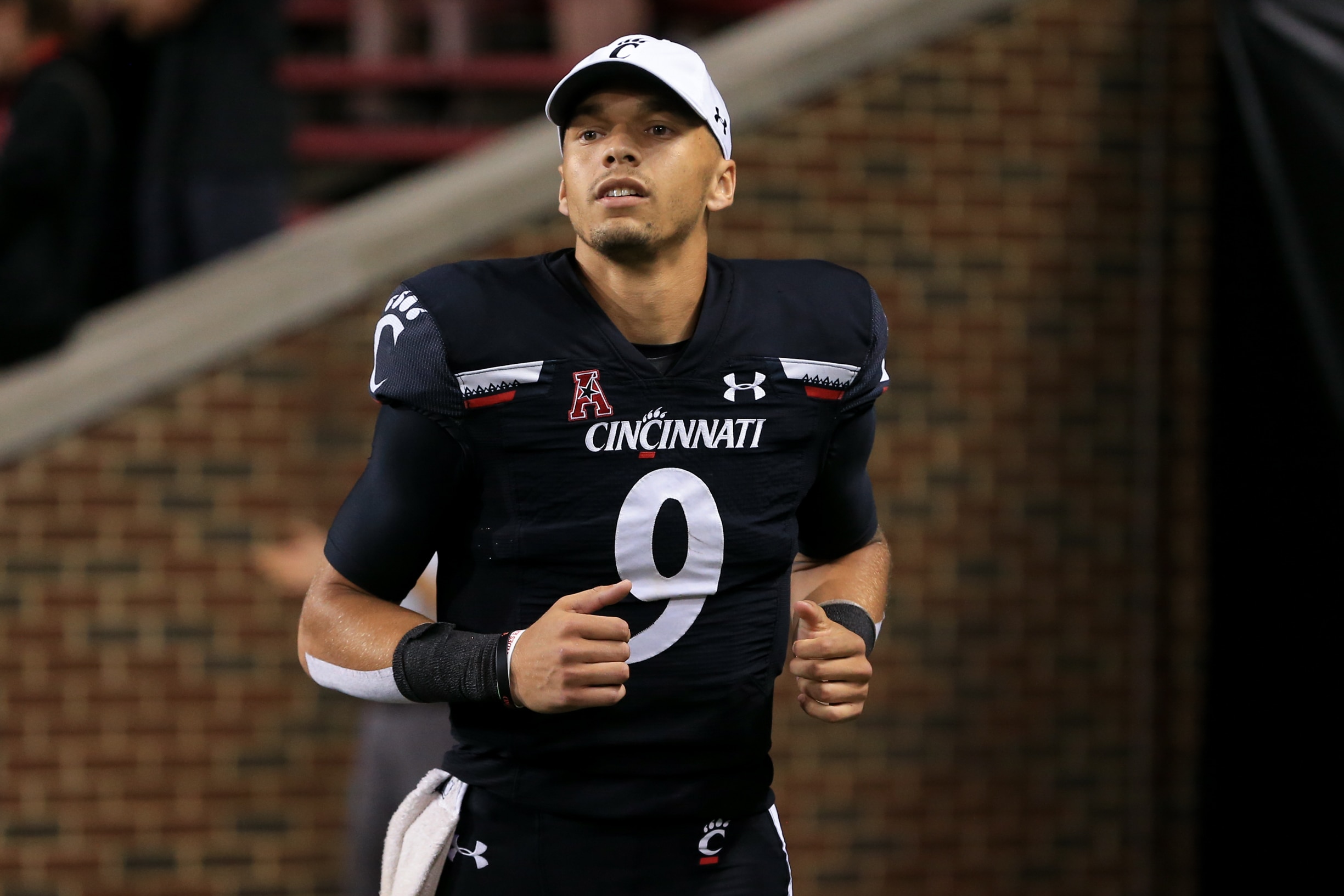 CINCINNATI, OH - OCTOBER 08: Cincinnati Bearcats quarterback Desmond Ridder (9) runs off the field after the game against the Temple Owls and the Cincinnati Bearcats on October 8, 2021, at Nippert Stadium in Cincinnati, OH. (Photo by Ian Johnson/Icon Sportswire via Getty Images)