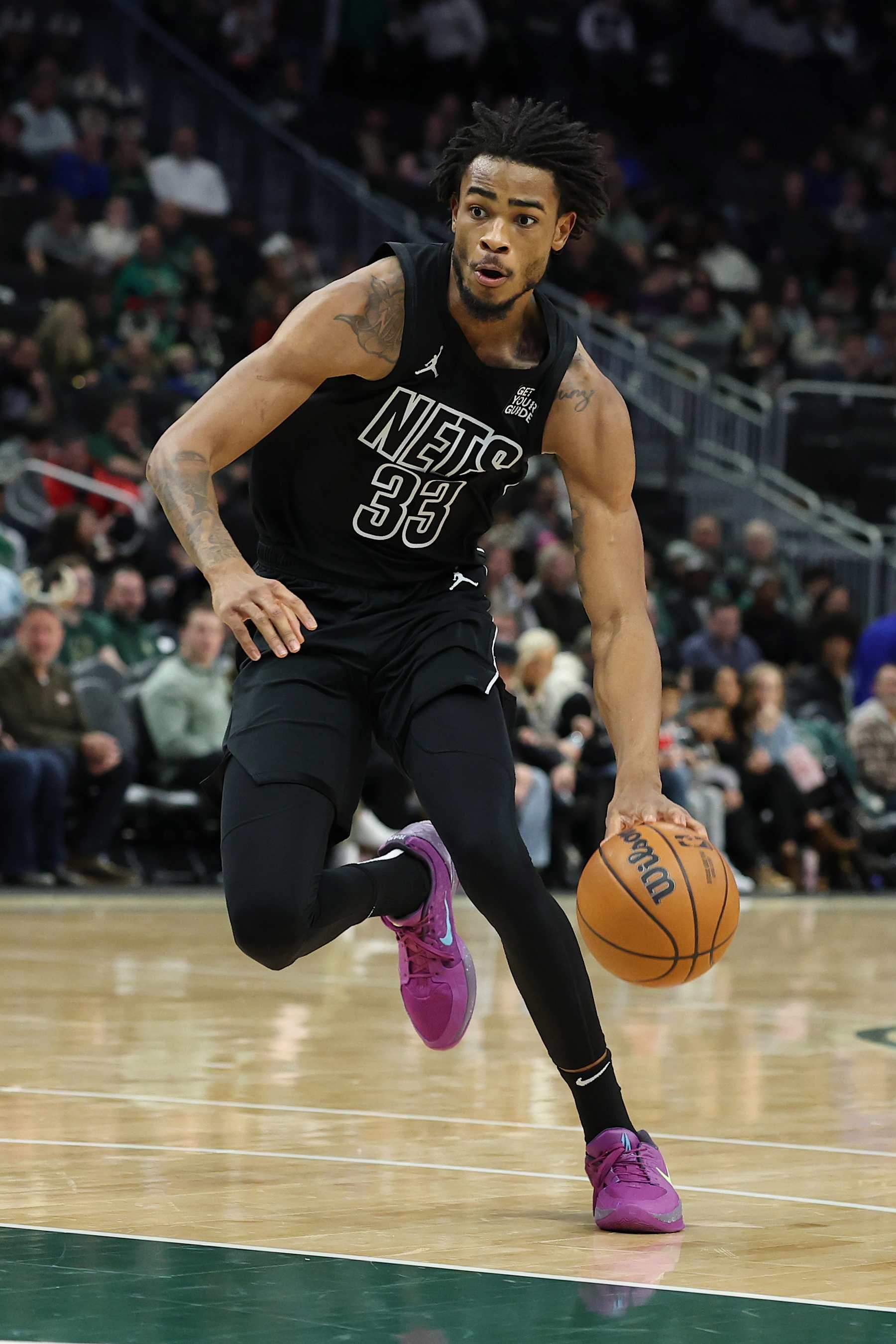 MILWAUKEE, WISCONSIN - JANUARY 02: Nic Claxton #33 of the Brooklyn Nets handles the ball during a game against the Milwaukee Bucks at Fiserv Forum on January 02, 2025 in Milwaukee, Wisconsin. The Nets defeated the Bucks 113-110. NOTE TO USER: User expressly acknowledges and agrees that, by downloading and or using this photograph, User is consenting to the terms and conditions of the Getty Images License Agreement. (Photo by Stacy Revere/Getty Images)