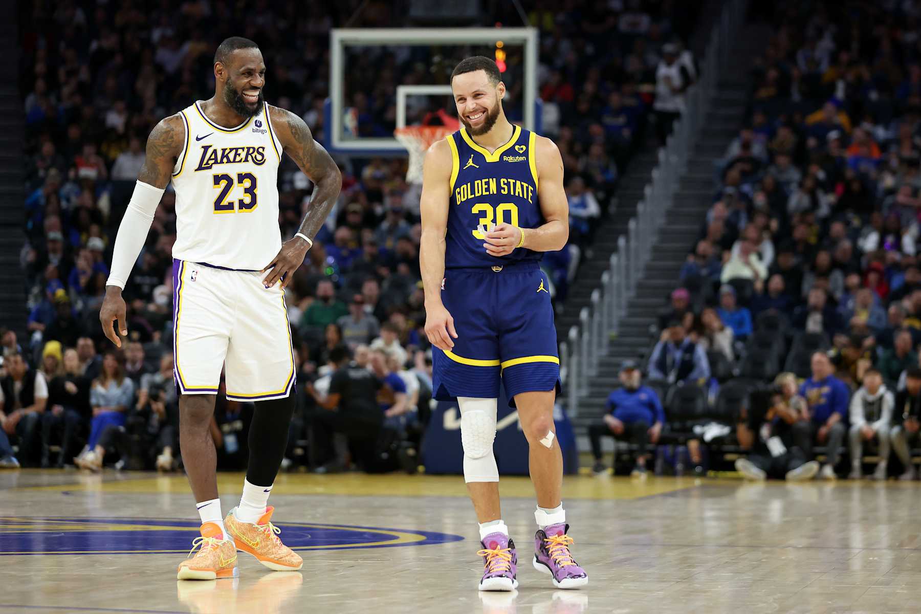 SAN FRANCISCO, CALIFORNIA - JANUARY 27: Stephen Curry #30 of the Golden State Warriors and LeBron James #23 of the Los Angeles Lakers joke around with one another during their game at Chase Center on January 27, 2024 in San Francisco, California. NOTE TO USER: User expressly acknowledges and agrees that, by downloading and or using this photograph, User is consenting to the terms and conditions of the Getty Images License Agreement.  (Photo by Ezra Shaw/Getty Images)