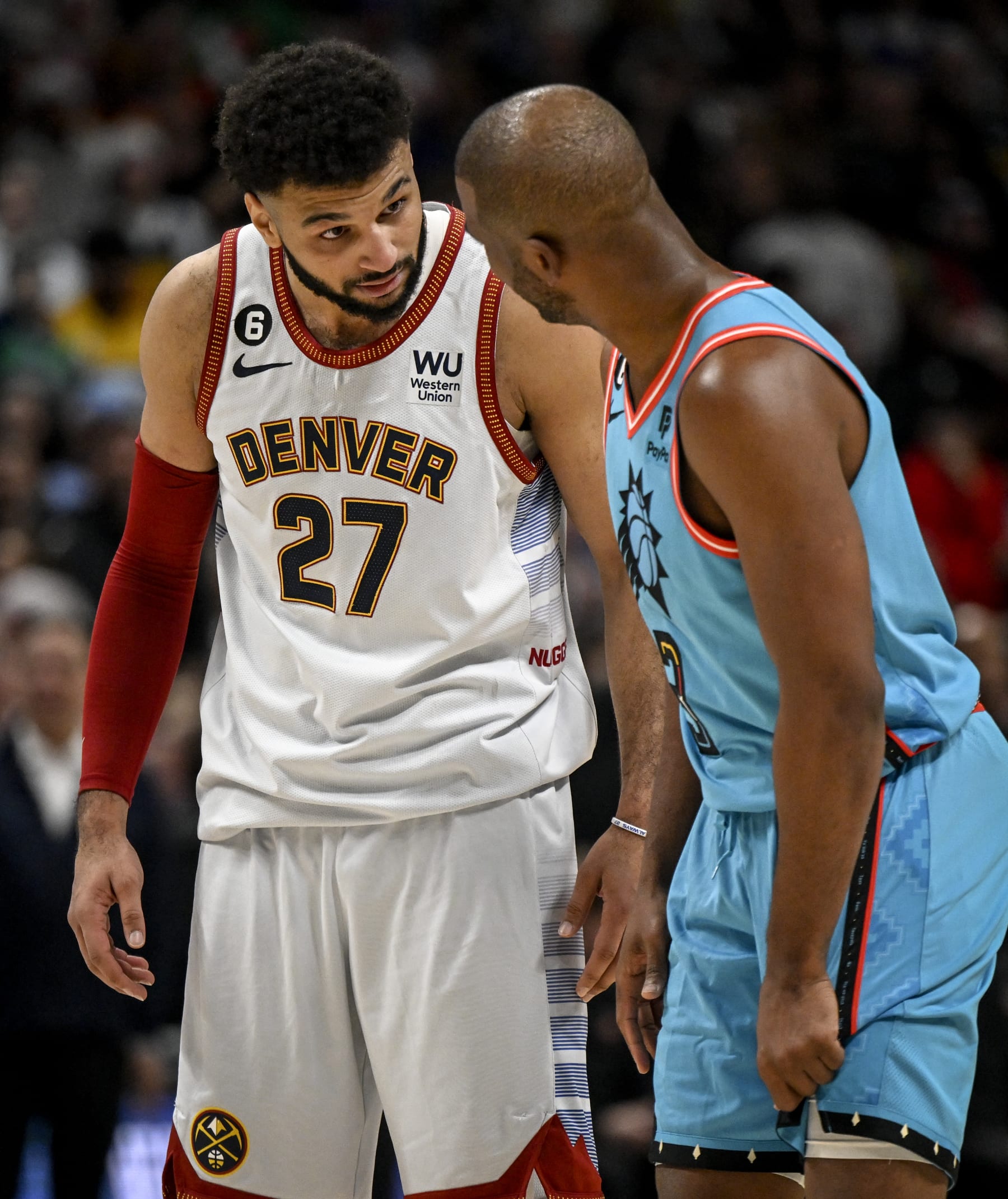 DENVER, CO - DECEMBER 26: Jamal Murray (27) of the Denver Nuggets and Chris Paul (3) of the Phoenix Suns jaw during overtime of Denvers 128-125 win at Ball Arena in Denver on Sunday, December 25, 2022. (Photo by AAron Ontiveroz/MediaNews Group/The Denver Post via Getty Images)