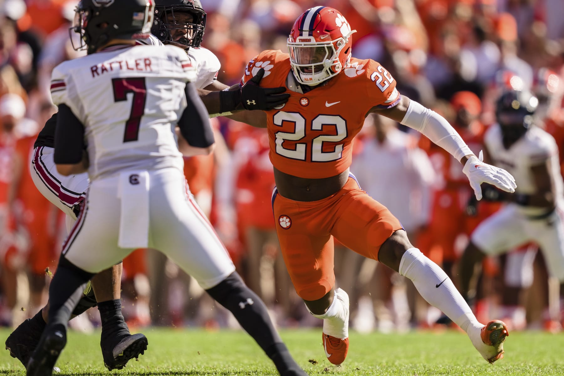Clemson linebacker Trenton Simpson (22) pressures South Carolina quarterback Spencer Rattler (7) during an NCAA college football game on Saturday, Nov. 26, 2022, in Clemson, S.C. (AP Photo/Jacob Kupferman)