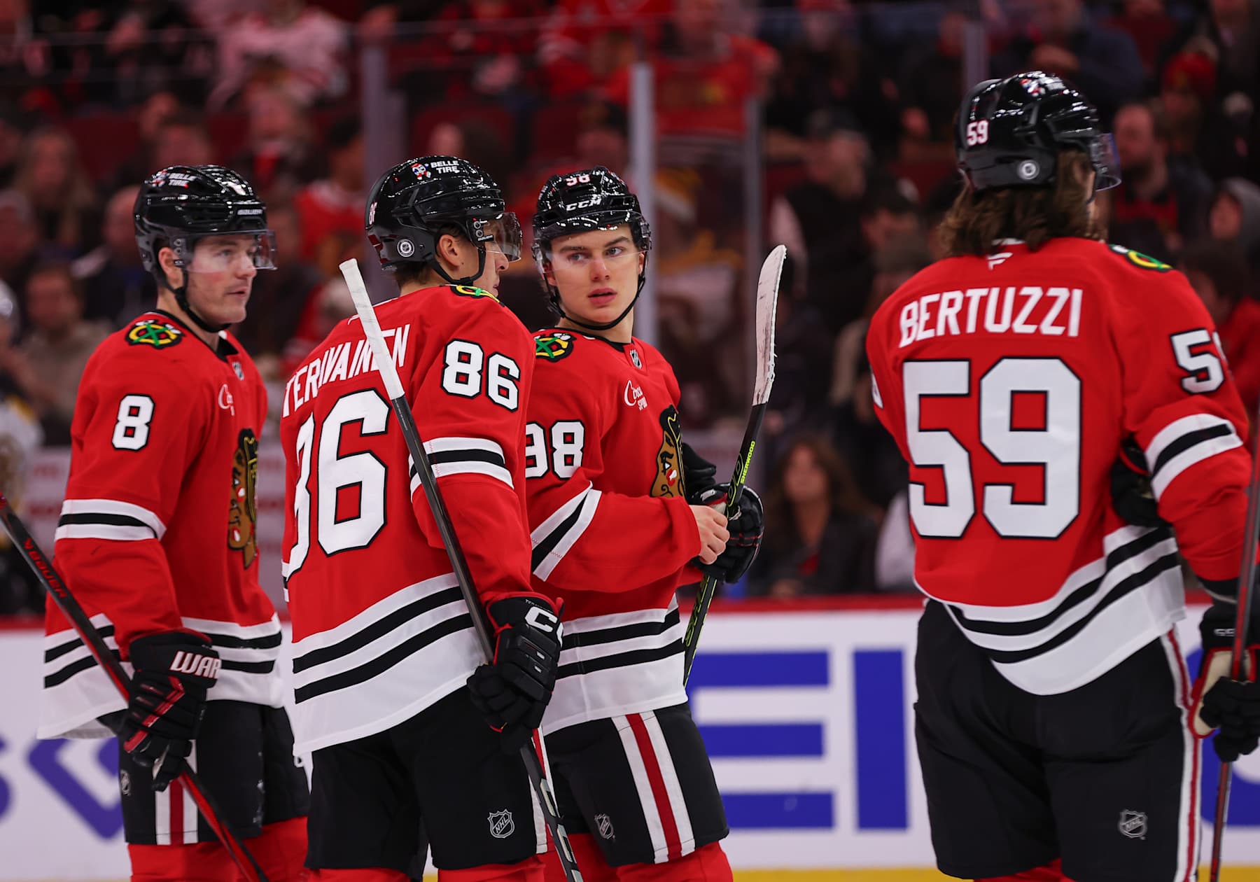 CHICAGO, IL - DECEMBER 04: Connor Bedard #98 of the Chicago Blackhawks chats with Teuvo Teravainen #86 of the Chicago Blackhawks during the first period against the Boston Bruins on December 4, 2024 at the United Center in Chicago, Illinois. (Photo by Melissa Tamez/Icon Sportswire via Getty Images)