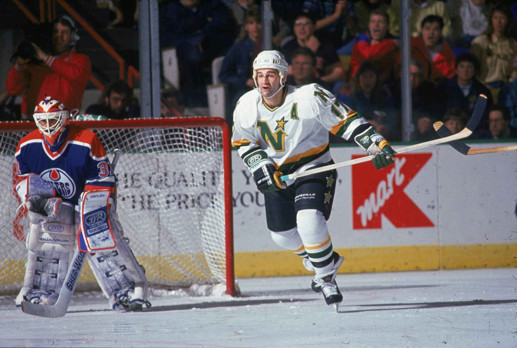 Canadian ice hockey player Basil McRae (right) of the Minnesota North Stars skates past the net during a playoff game against the Edmonton Oilers at the Met Center, Bloomington, Minnesota, May 1991. (Photo by Bruce Bennett Studios via Getty Images Studios/Getty Images) 