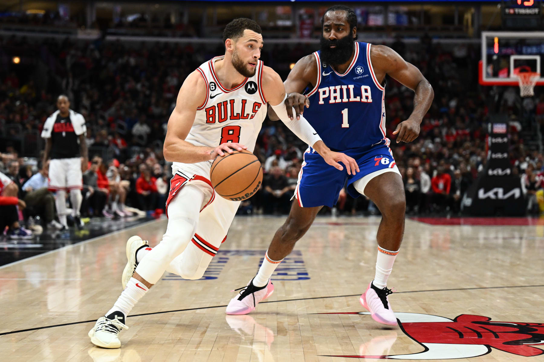 CHICAGO, ILLINOIS - OCTOBER 29: Zach Lavine #8 of the Chicago Bulls drives around James Harden #1 of the Philadelphia 76ers in the second half on October 29, 2022 at the United Center in Chicago, Illinois. Philadelphia defeated Chicago 114-109. NOTE TO USER: User expressly acknowledges and agrees that, by downloading and or using this photograph, User is consenting to the terms and conditions of the Getty Images License Agreement. (Photo by Jamie Sabau/Getty Images)