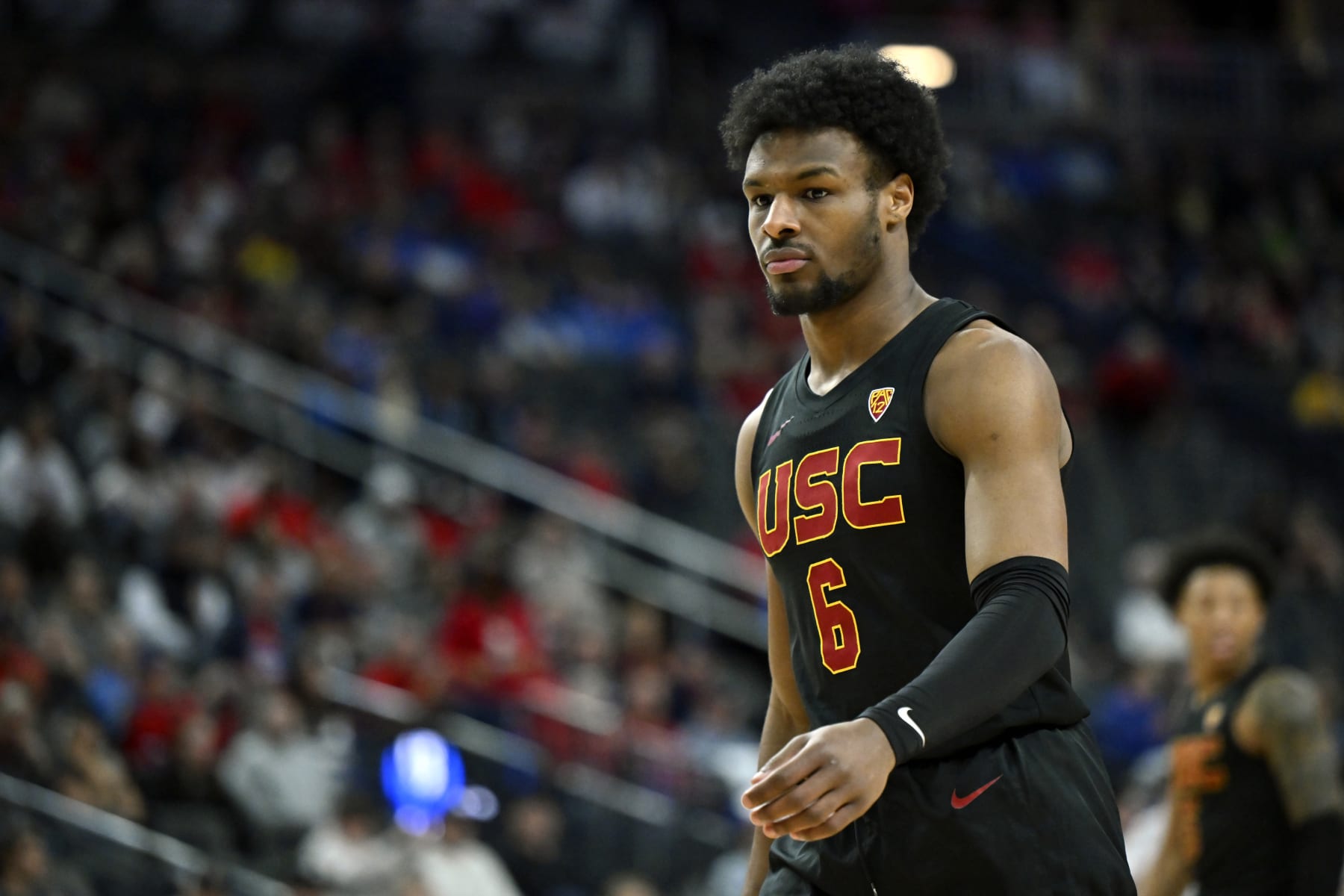 LAS VEGAS, NEVADA - MARCH 14: Bronny James #6 of the USC Trojans looks on in the second half of a quarterfinal game against the Arizona Wildcats during the Pac-12 Conference basketball tournament at T-Mobile Arena on March 14, 2024 in Las Vegas, Nevada. The Wildcats defeated the Trojans 70-49. (Photo by David Becker/Getty Images)