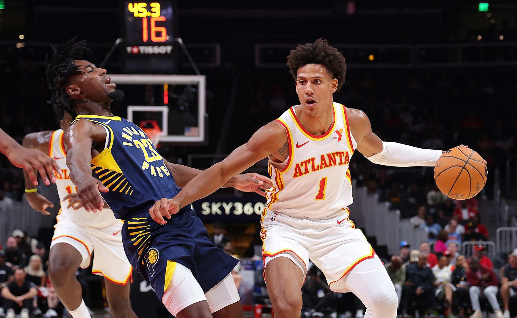 ATLANTA, GEORGIA - OCTOBER 08:  Jalen Johnson #1 of the Atlanta Hawks is charged with an offensive foul as he drives into Aaron Nesmith #23 of the Indiana Pacers during the second quarter at State Farm Arena on October 08, 2024 in Atlanta, Georgia.  NOTE TO USER: User expressly acknowledges and agrees that, by downloading and/or using this photograph, user is consenting to the terms and conditions of the Getty Images License Agreement.  (Photo by Kevin C. Cox/Getty Images)