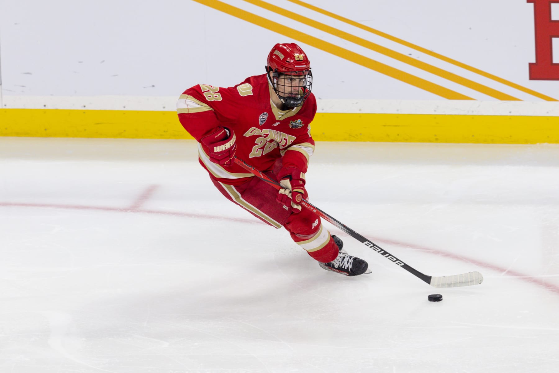 ST. PAUL, MN - APRIL 13: Denver Pioneers defenseman Zeev Buium (28) skates with the puck during the men's Frozen Four championship game between the Boston College Eagles and the Denver Pioneers on April 13th, 2024, in St. Paul, Minnesota. (Photo by Bailey Hillesheim/Icon Sportswire via Getty Images)
