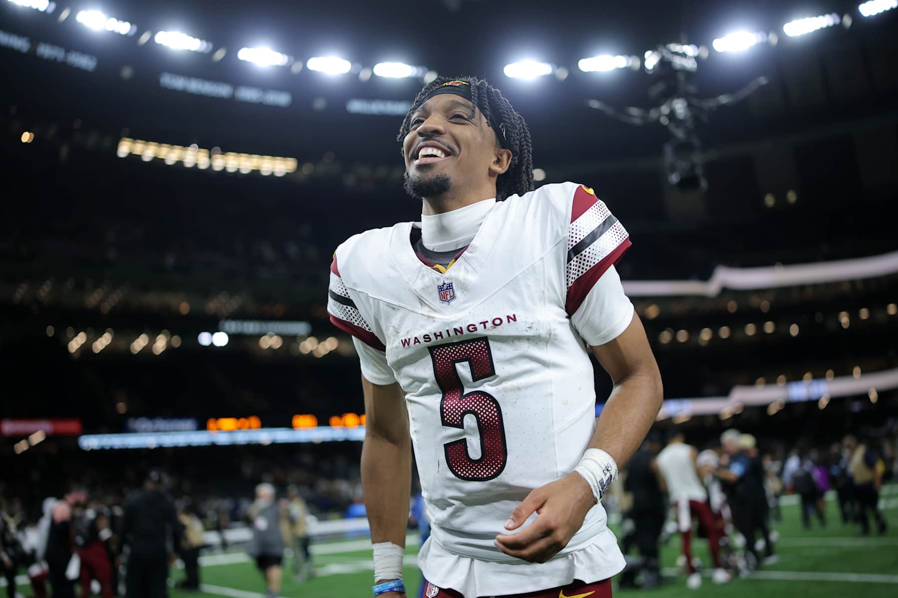 NEW ORLEANS, LOUISIANA - DECEMBER 15: Jayden Daniels #5 of the Washington Commanders reacts against the New Orleans Saints during a game at Caesars Superdome on December 15, 2024 in New Orleans, Louisiana. (Photo by Jonathan Bachman/Getty Images)