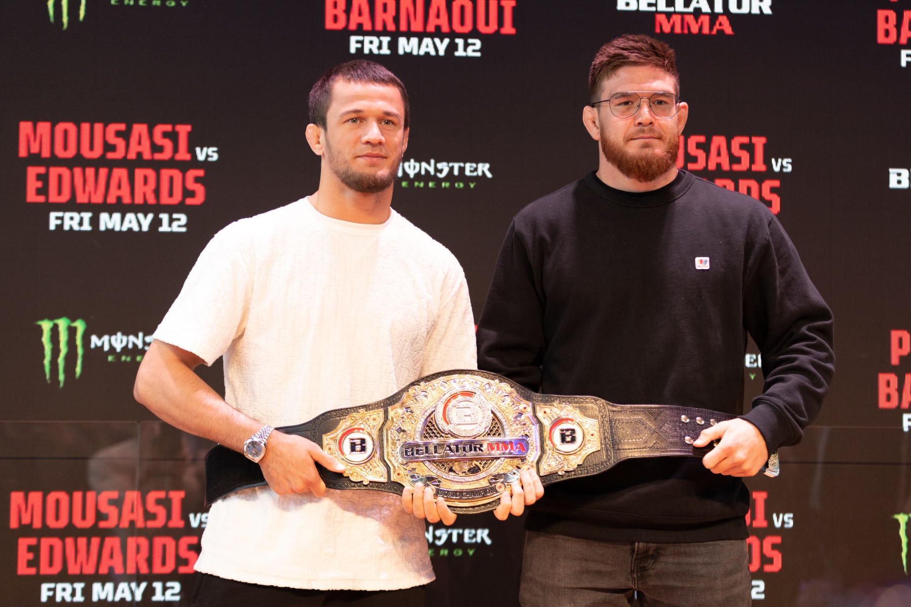 PARIS, FRANCE - MAY 09: (L-R) Usman Nurmagomedov and Johnny Eblen pose with the belt during the Bellator 296 press conference event inside Gustave Eiffel Lounge on May 9, 2023 in Paris, France. (Photo by José Prestes/PxImages/Icon Sportswire via Getty Images)