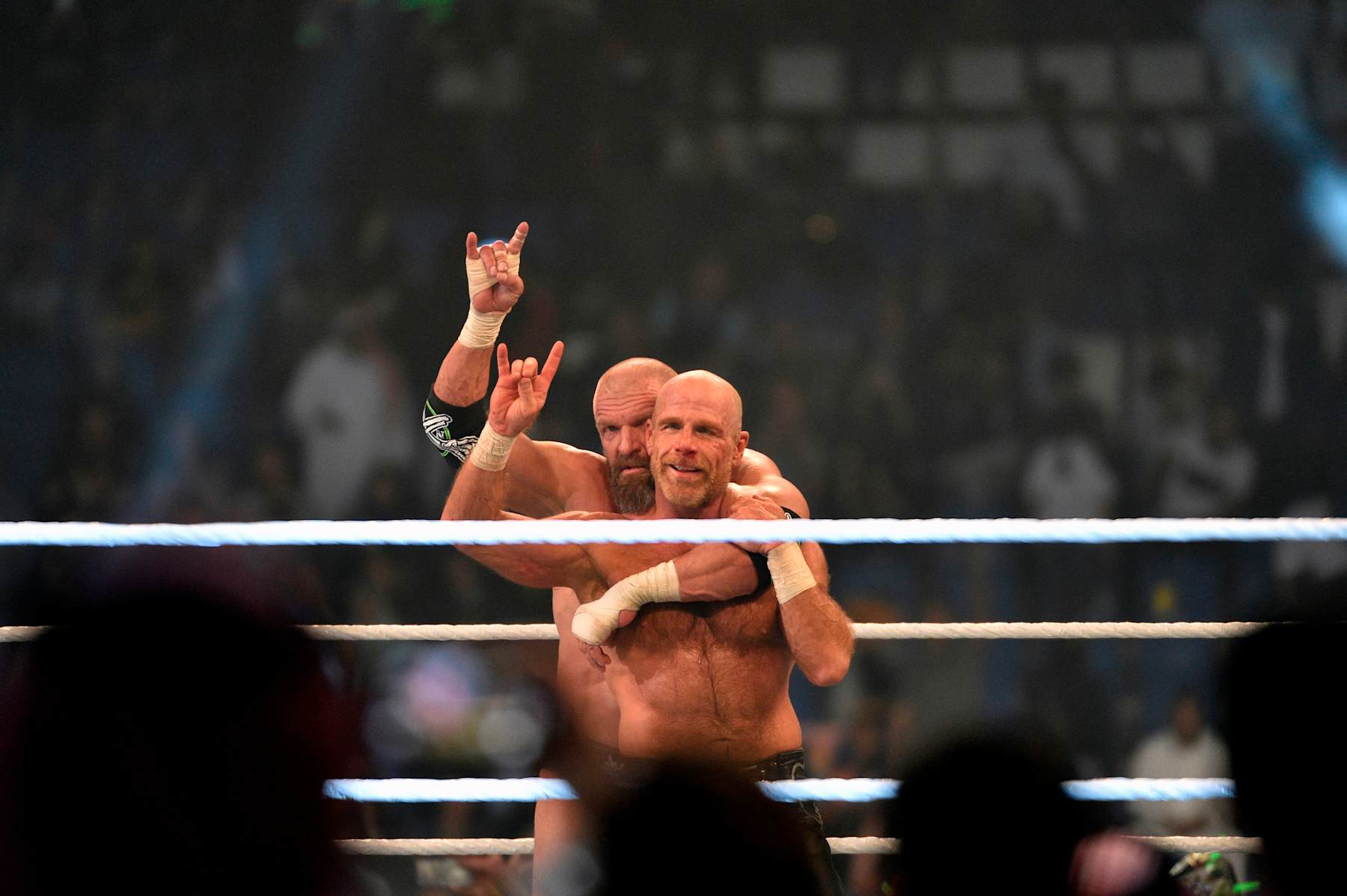 Shawn Michaels (R) and Triple H, of D-Generation X, celebrate their win during a tag team match as part of as part of the World Wrestling Entertainment (WWE) Crown Jewel pay-per-view at the King Saud University Stadium in Riyadh on November 2, 2018. (Photo by Fayez Nureldine / AFP)        (Photo credit should read FAYEZ NURELDINE/AFP via Getty Images)