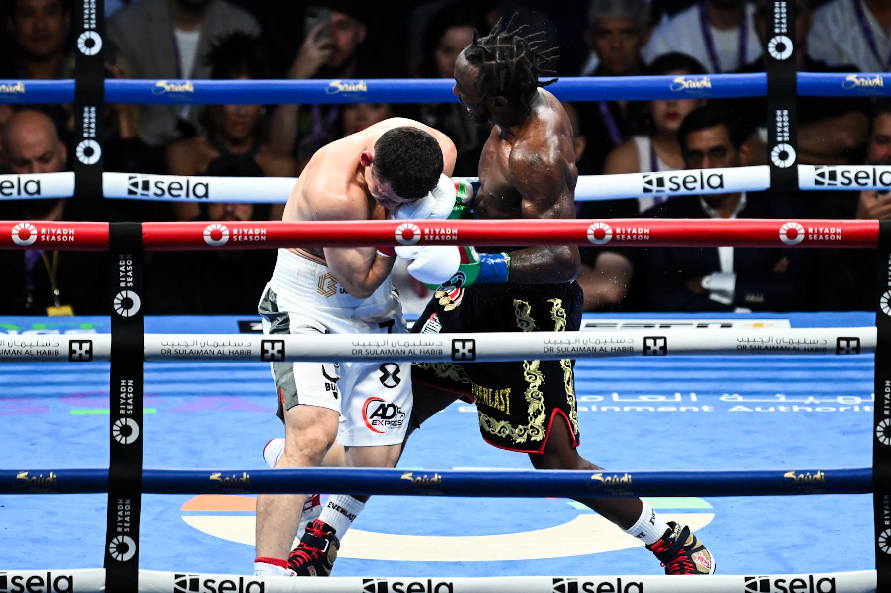 LOS ANGELES, CALIFORNIA - AUGUST 03: Terence Crawford 'Bud' (black) from Omaha, Nebraska and Israil Madrimov 'The Dream' (white) from Uzbekistan exchange punches during their WBA World WBO Interim title of the Premiere Boxing Championship during Riyadh Season on Saturday night at the BMO Stadium in Los Angeles, California United States on August 03, 2024. (Photo by Tayfun Coskun/Anadolu via Getty Images)
