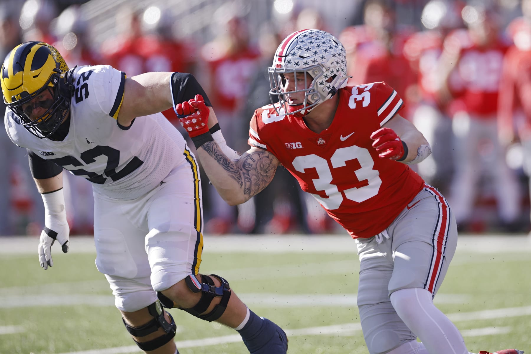 COLUMBUS, OH - NOVEMBER 26: Ohio State Buckeyes defensive end Jack Sawyer (33) rushes against Michigan Wolverines offensive lineman Karsen Barnhart (52) during a college football game on November 26, 2022 at Ohio Stadium in Columbus, Ohio. (Photo by Joe Robbins/Icon Sportswire via Getty Images)