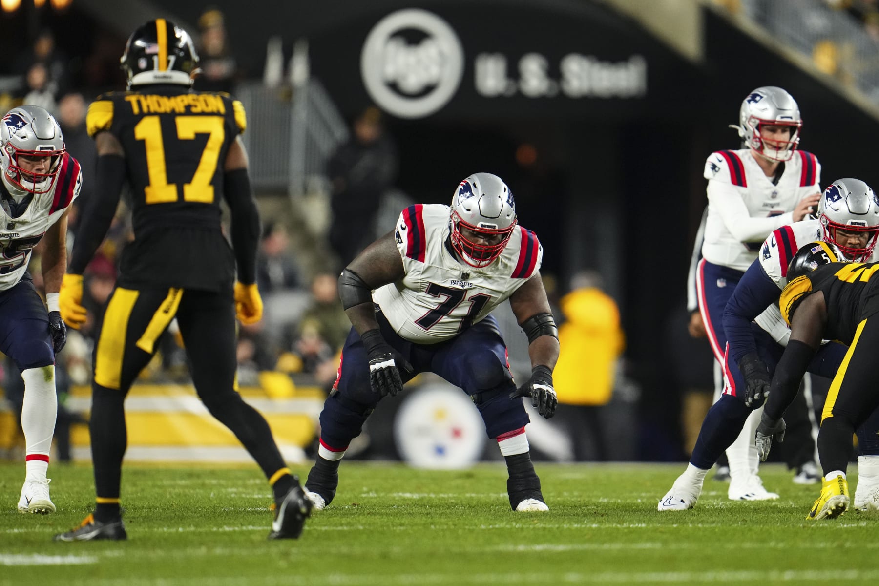 PITTSBURGH, PA - DECEMBER 07: Mike Onwenu #71 of the New England Patriots drops back to block during an NFL football game against the Pittsburgh Steelers at Acrisure Stadium on December 7, 2023 in Pittsburgh, Pennsylvania. (Photo by Cooper Neill/Getty Images)
