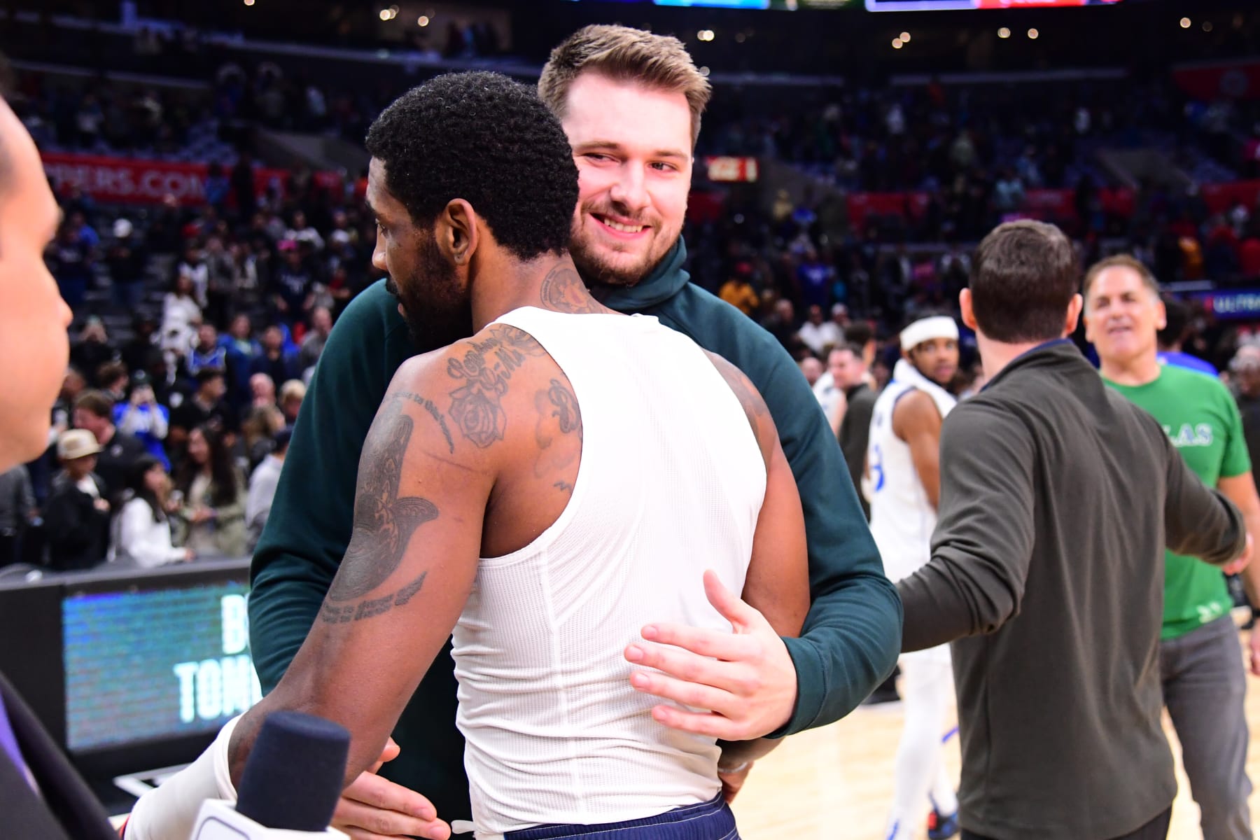 LOS ANGELES, CA - FEBRUARY 8: Luka Doncic #77 of the Dallas Mavericks embraces Kyrie Irving #2 of the Dallas Mavericks after the game against the LA Clippers on February 8, 2023 at Crypto.Com Arena in Los Angeles, California. NOTE TO USER: User expressly acknowledges and agrees that, by downloading and/or using this Photograph, user is consenting to the terms and conditions of the Getty Images License Agreement. Mandatory Copyright Notice: Copyright 2023 NBAE (Photo by Adam Pantozzi/NBAE via Getty Images)