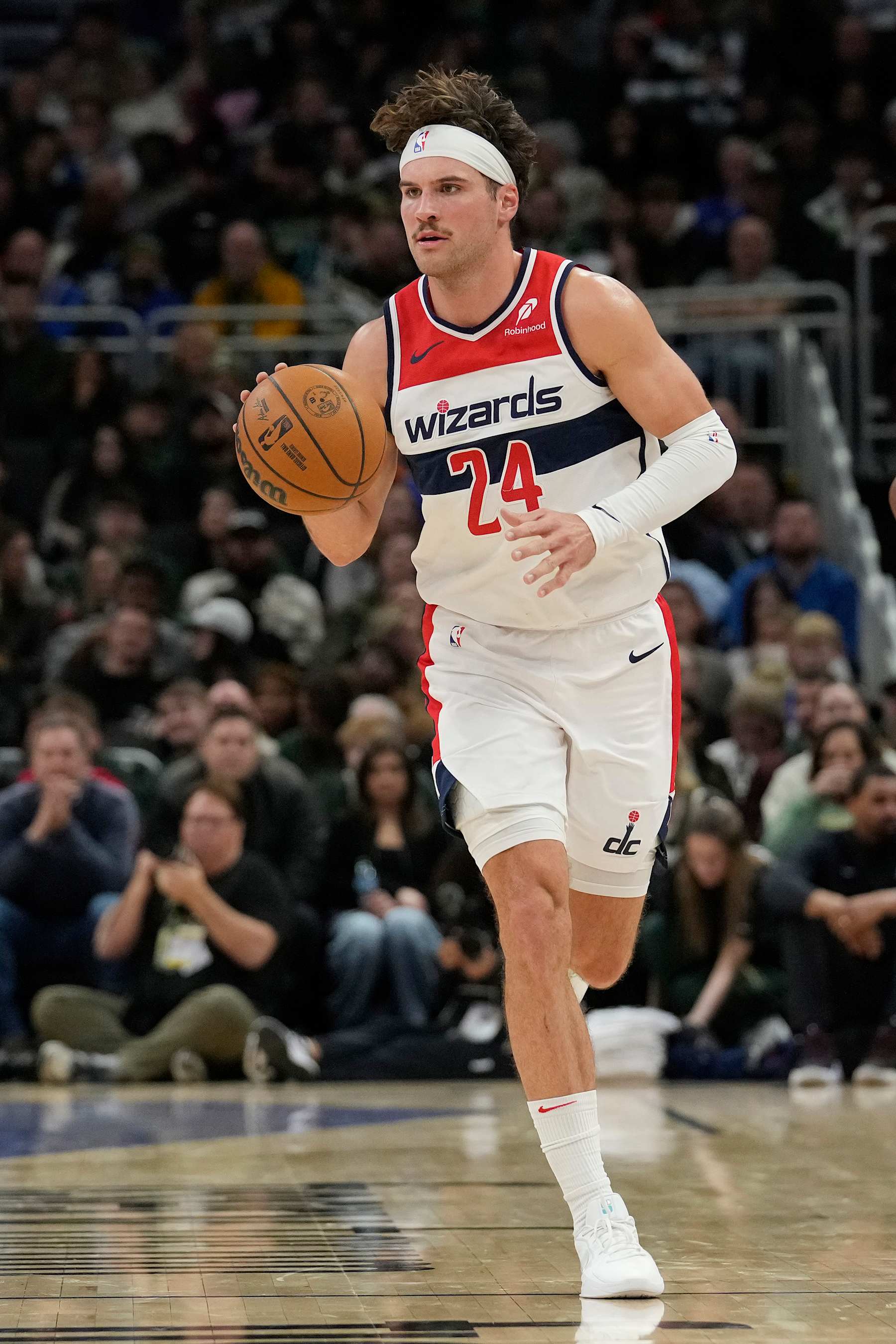 MILWAUKEE, WISCONSIN - NOVEMBER 30: Corey Kispert #24 of the Washington Wizards dribbles the ball against the Milwaukee Bucks during the fourth quarter of a game at Fiserv Forum on November 30, 2024 in Milwaukee, Wisconsin. NOTE TO USER: User expressly acknowledges and agrees that, by downloading and or using this photograph, User is consenting to the terms and conditions of the Getty Images License Agreement. (Photo by Patrick McDermott/Getty Images)