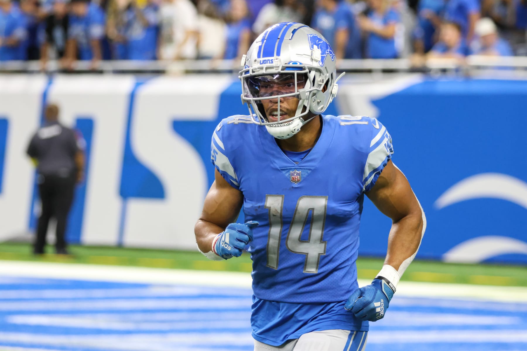 DETROIT, MI - SEPTEMBER 11:  Detroit Lions wide receiver Amon-Ra St. Brown (14) runs off of the field after catching a touchdown pass during a regular season NFL football game between the Philadelphia Eagles and the Detroit Lions on September 11, 2022 at Ford Field in Detroit, Michigan.  (Photo by Scott W. Grau/Icon Sportswire via Getty Images)