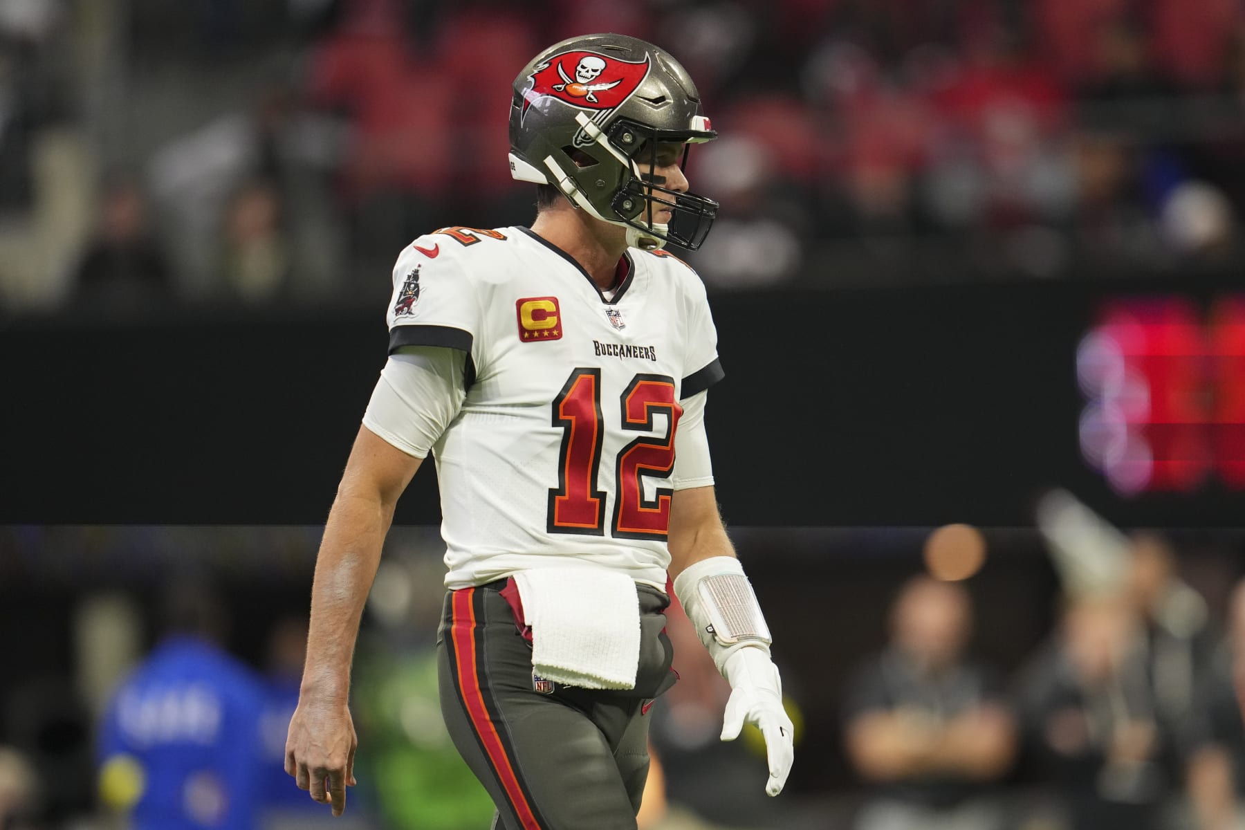 ATLANTA, GA - JANUARY 08: Tom Brady #12 of the Tampa Bay Buccaneers gets set against the Atlanta Falcons at Mercedes-Benz Stadium on January 8, 2023 in Atlanta, Georgia. (Photo by Cooper Neill/Getty Images)