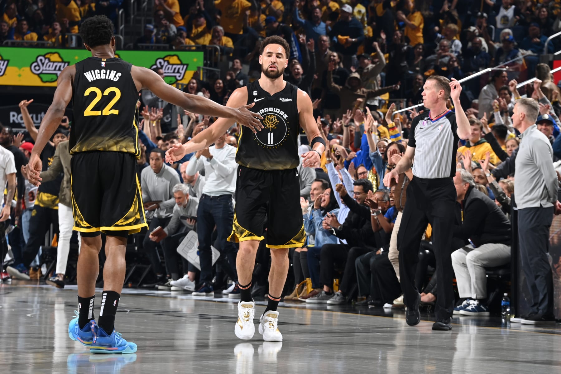 LOS ANGELES, CA - May 2: Andrew Wiggins #22 of the Golden State Warriors high fives Klay Thompson #11 during Game 1 of the Western Conference Semi-Finals 2023 NBA Playoffs on May 2, 2023 at Crypto.Com Arena in Los Angeles, California. NOTE TO USER: User expressly acknowledges and agrees that, by downloading and/or using this Photograph, user is consenting to the terms and conditions of the Getty Images License Agreement. Mandatory Copyright Notice: Copyright 2023 NBAE (Photo by Andrew D. Bernstein/NBAE via Getty Images)