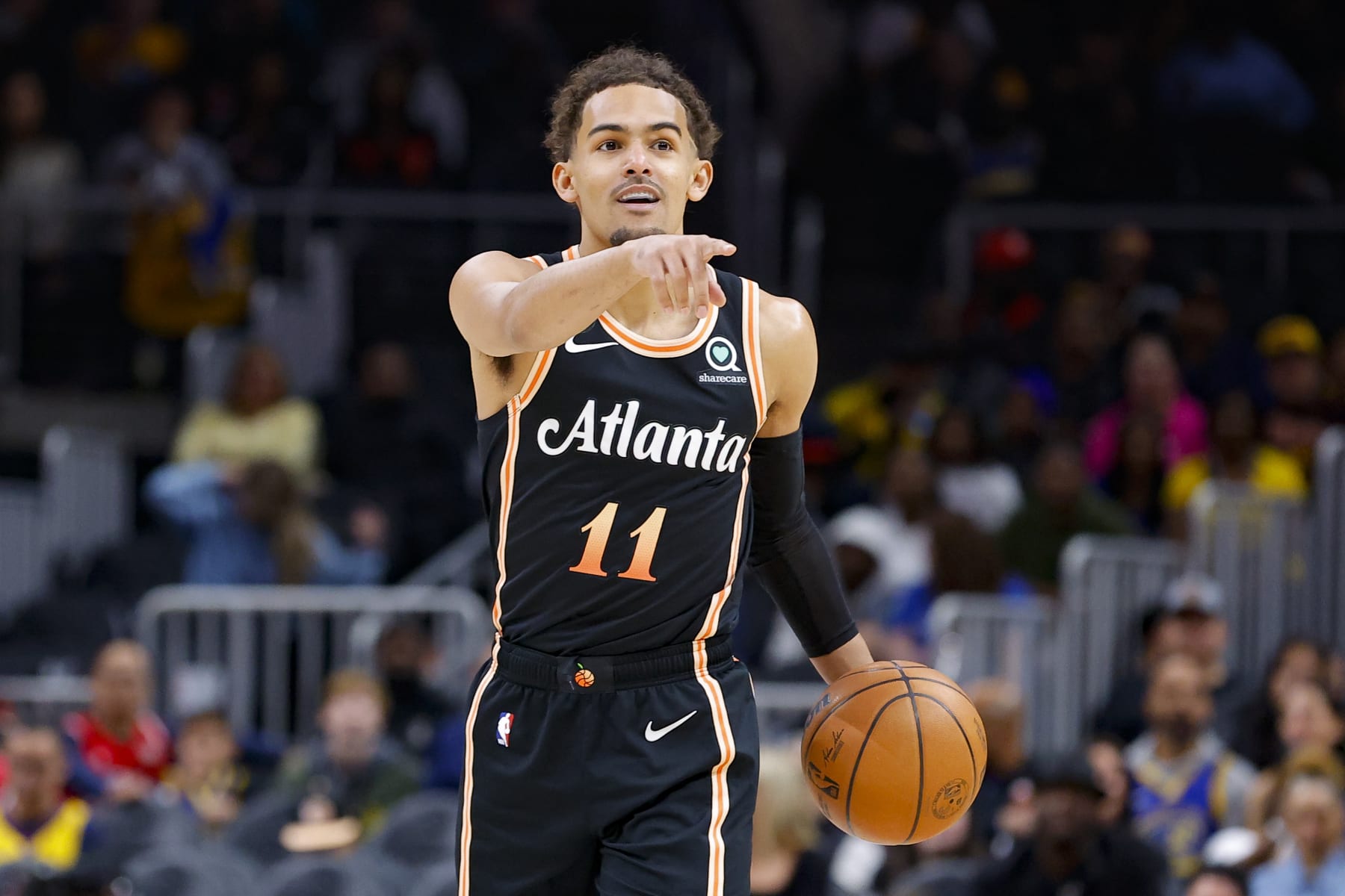 ATLANTA, GA - MARCH 17: Trae Young #11 of the Atlanta Hawks sets up a play during the first half against the Golden State Warriors at State Farm Arena on March 17, 2023 in Atlanta, Georgia. NOTE TO USER: User expressly acknowledges and agrees that, by downloading and or using this photograph, User is consenting to the terms and conditions of the Getty Images License Agreement. (Photo by Todd Kirkland/Getty Images)