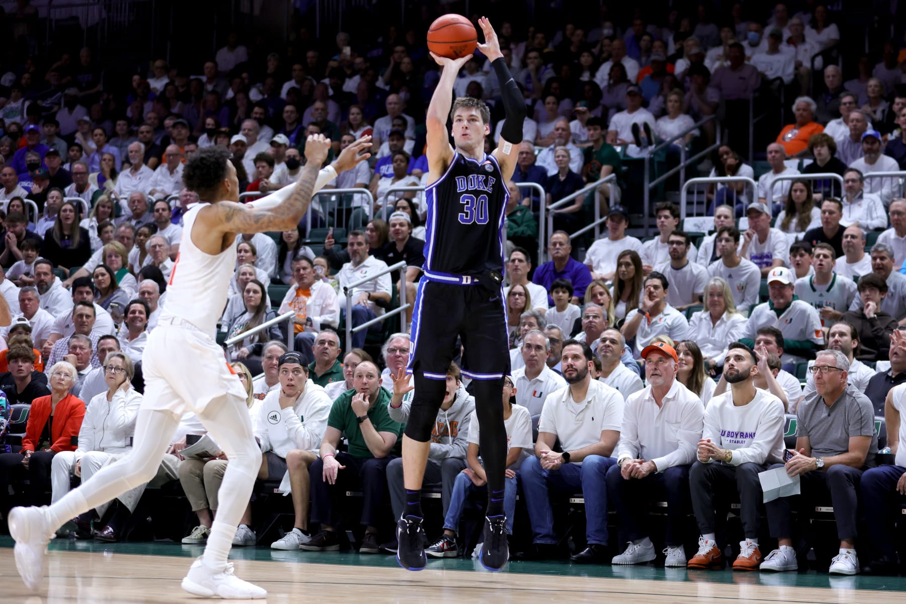 CORAL GABLES, FLORIDA - FEBRUARY 06: Kyle Filipowski #30 of the Duke Blue Devils shoots against the Miami Hurricanes during the first half of the game at Watsco Center on February 06, 2023 in Coral Gables, Florida. (Photo by Megan Briggs/Getty Images)