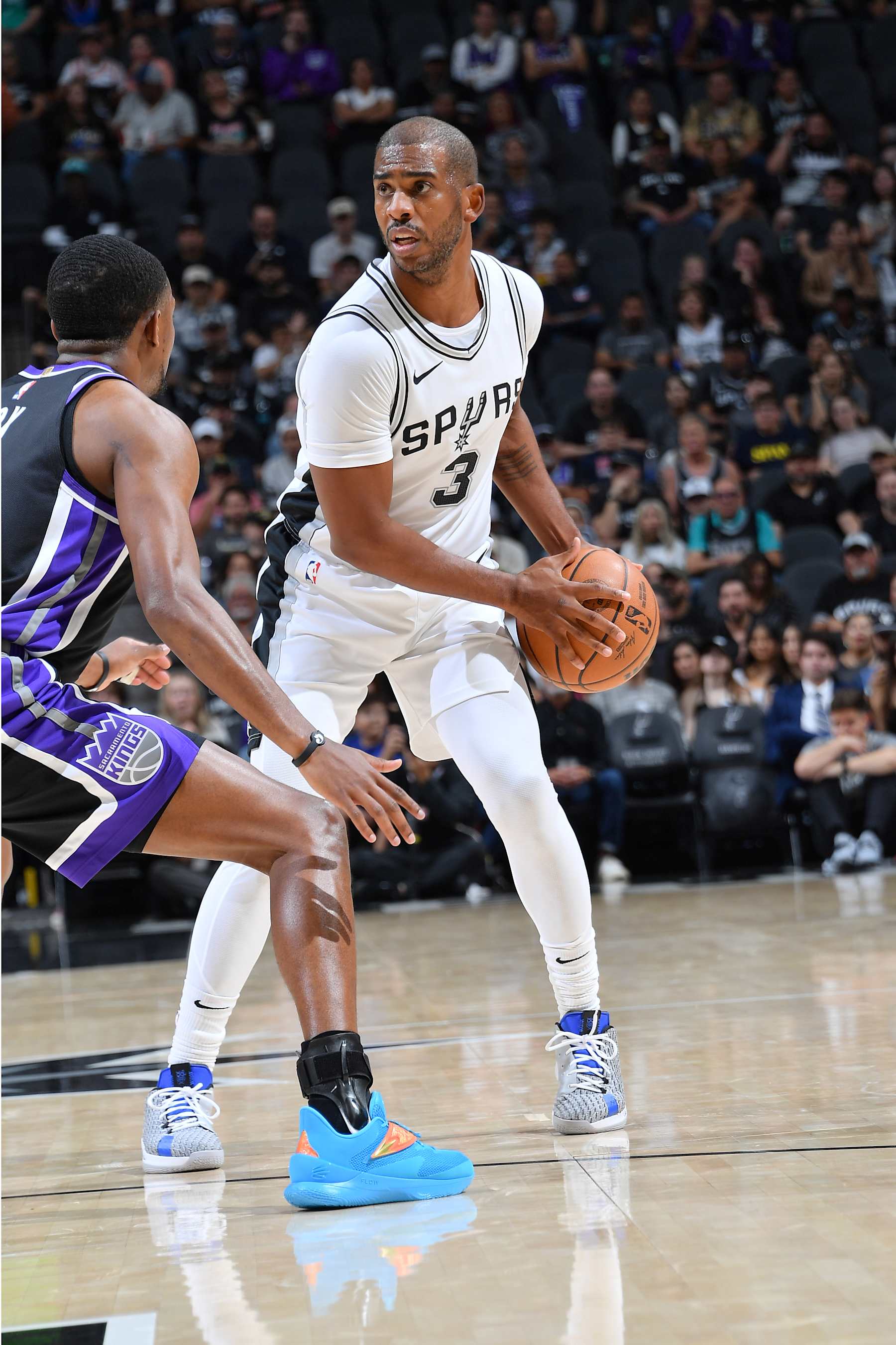 SAN ANTONIO, TX - NOVEMBER 11: Chris Paul #3 of the San Antonio Spurs handles the ball during the game against the Sacramento Kings  during a regular season game on November 11, 2024 at the Frost Bank Center in San Antonio, Texas. NOTE TO USER: User expressly acknowledges and agrees that, by downloading and or using this photograph, user is consenting to the terms and conditions of the Getty Images License Agreement. Mandatory Copyright Notice: Copyright 2024 NBAE (Photos by Michael Gonzales/NBAE via Getty Images)