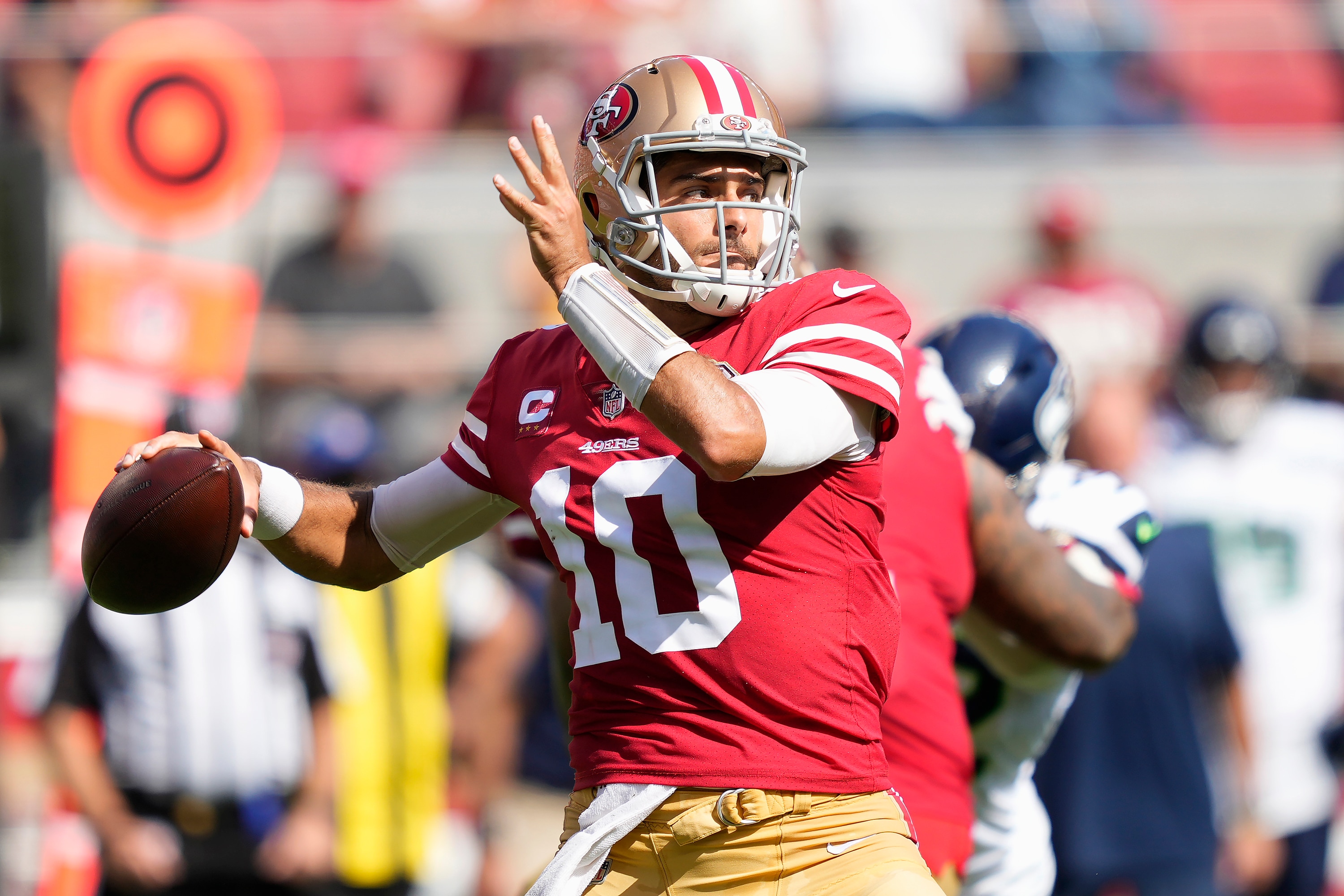San Francisco 49ers quarterback Jimmy Garoppolo (10) passes against the Seattle Seahawks during the first half of an NFL football game in Santa Clara, Calif., Sunday, Oct. 3, 2021. (AP Photo/Tony Avelar)