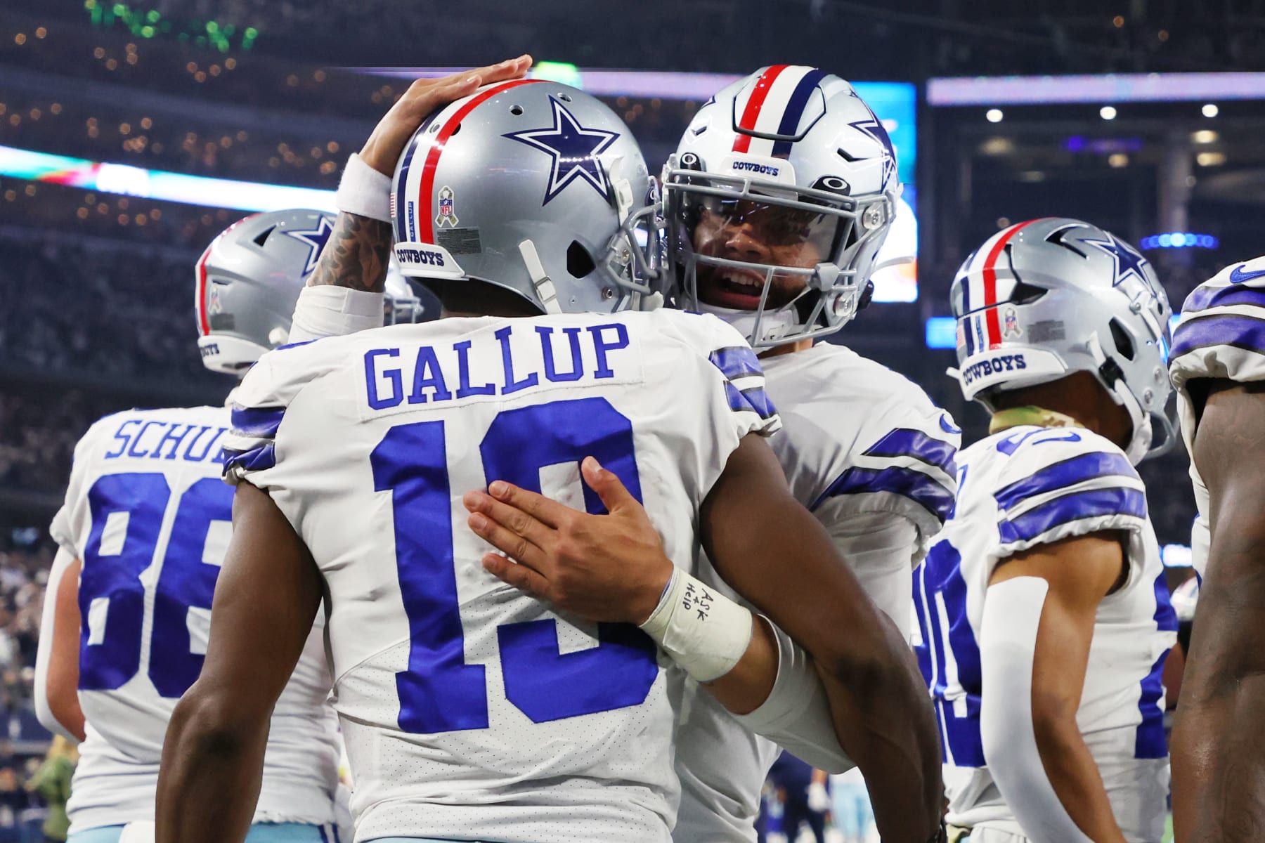 ARLINGTON, TEXAS - DECEMBER 04: Dak Prescott #4 of the Dallas Cowboys celebrates with Michael Gallup #13 of the Dallas Cowboys after a touchdown in the second quarter of a game Indianapolis Colts at AT&T Stadium on December 04, 2022 in Arlington, Texas. (Photo by Richard Rodriguez/Getty Images)