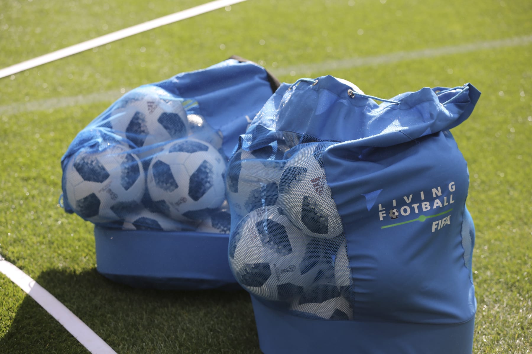 Practice soccer balls sit on the pitch in ball bags during preparations ahead of the FIFA World Cup opening ceremony at the Luzhniki stadium in Moscow, Russia, on Wednesday, June 13, 2018. According to an April report from the organizing committee, the total amount spent on preparations is 683 billion rubles, or about $11 billion at the current exchange rate. Photographer: Andrey Rudakov/Bloomberg via Getty Images