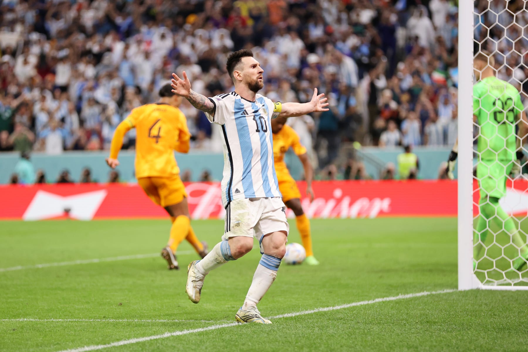 LUSAIL CITY, QATAR - DECEMBER 09: Lionel Messi of Argentina celebrates after scoring the team's second goal during the FIFA World Cup Qatar 2022 quarter final match between Netherlands and Argentina at Lusail Stadium on December 09, 2022 in Lusail City, Qatar. (Photo by Clive Brunskill/Getty Images)